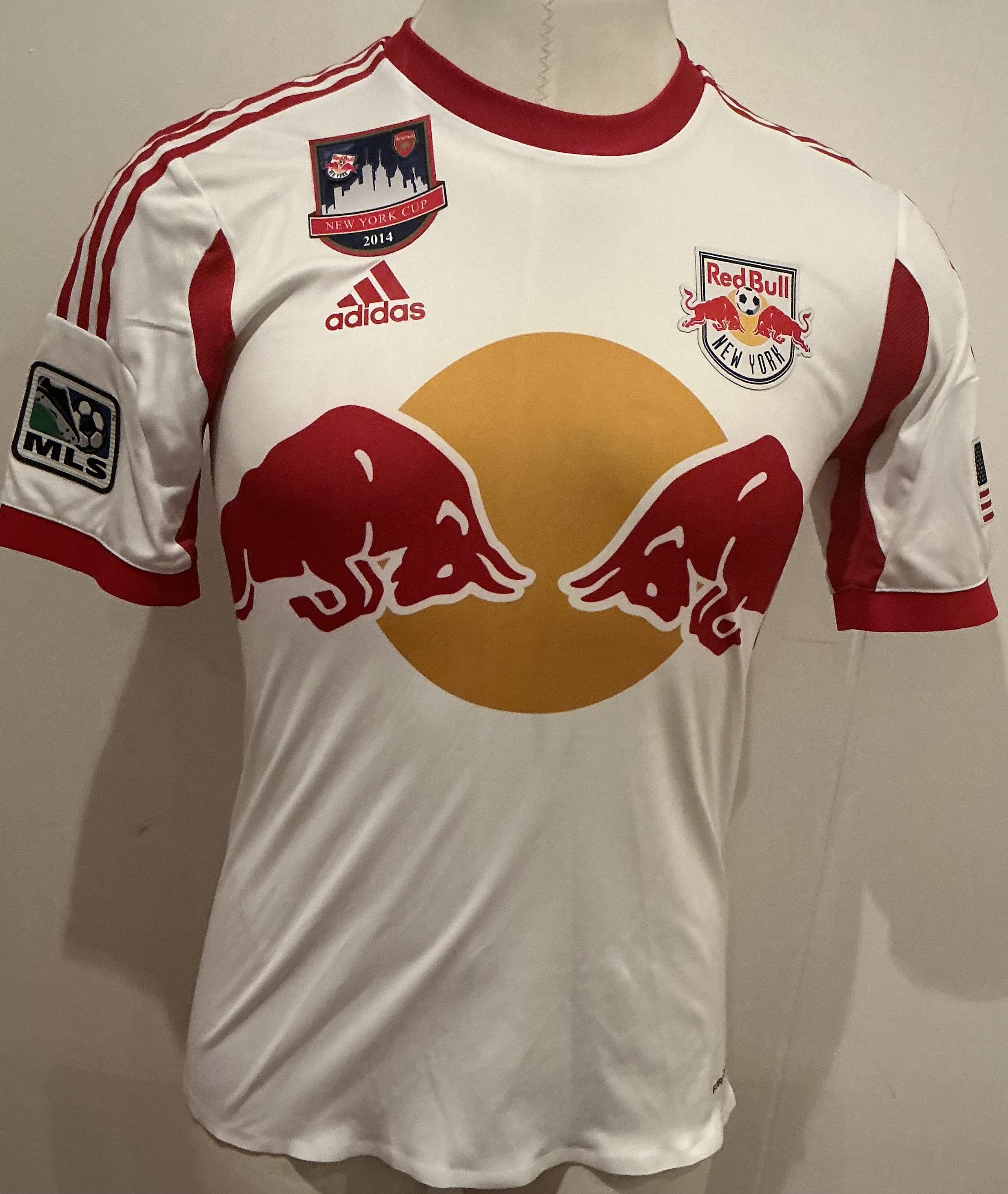 New York Red Bulls 2014 Match Worn Football Shirt v Arsenal: Worn in New York Cup v Arsenal and on the badging that states that, it has small badges of both teams. Short sleeve number 11 with McCarty to rear. Rare shirt.