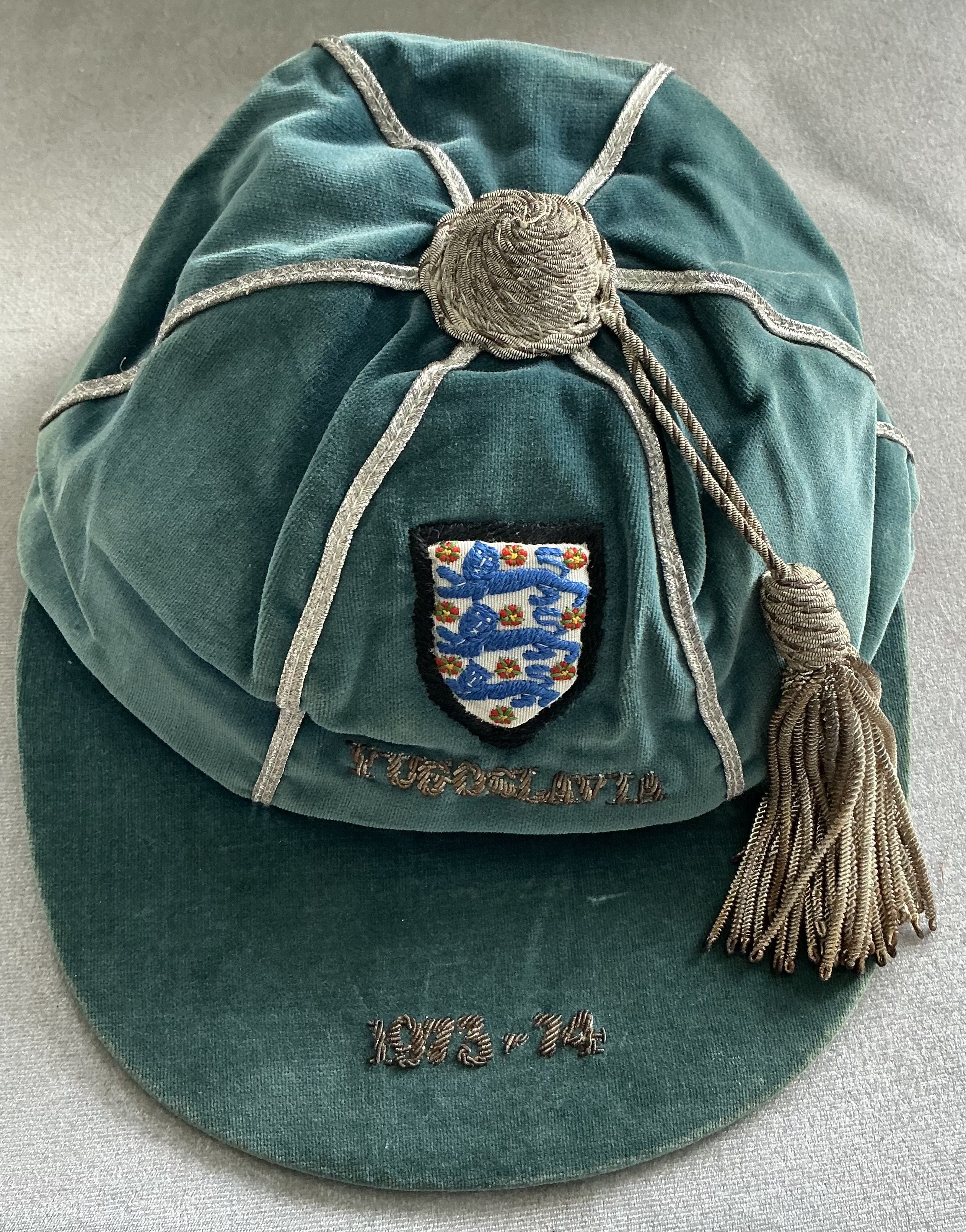 England 73/74 Full International Football Cap: Good condition blue cap awarded to Malcolm MacDonald for playing in the match v Yugoslavia on 5 6 1974. Football Wanted originally sold this cap and obtained it directly from Malcolm.
