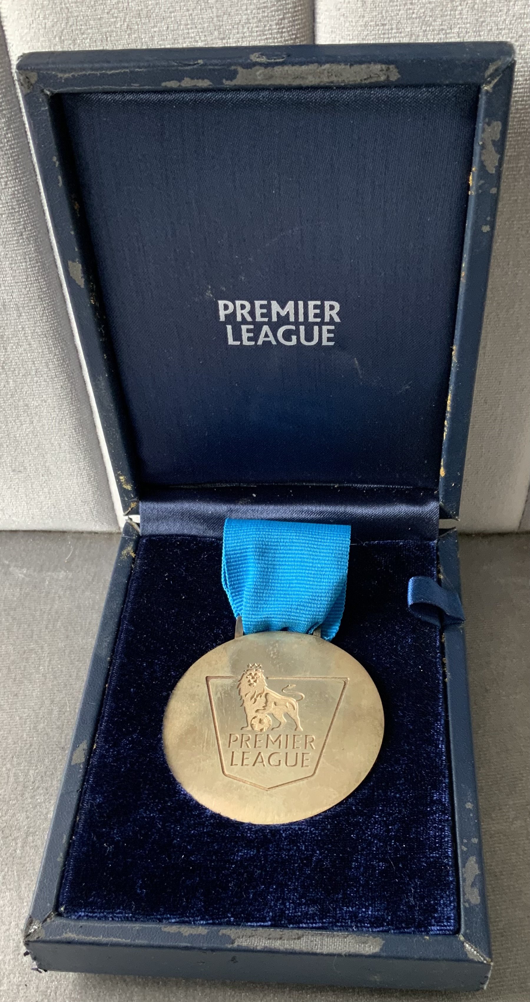 Manchester City 2013 - 2014 Premier League Winners Medal: One of only 40 made and awarded to players, chairman, secretary and a few back room staff. Premier League to one side the reverse stating Champions 2013/14 with Barclays Premier League logo. Coa from staff member.