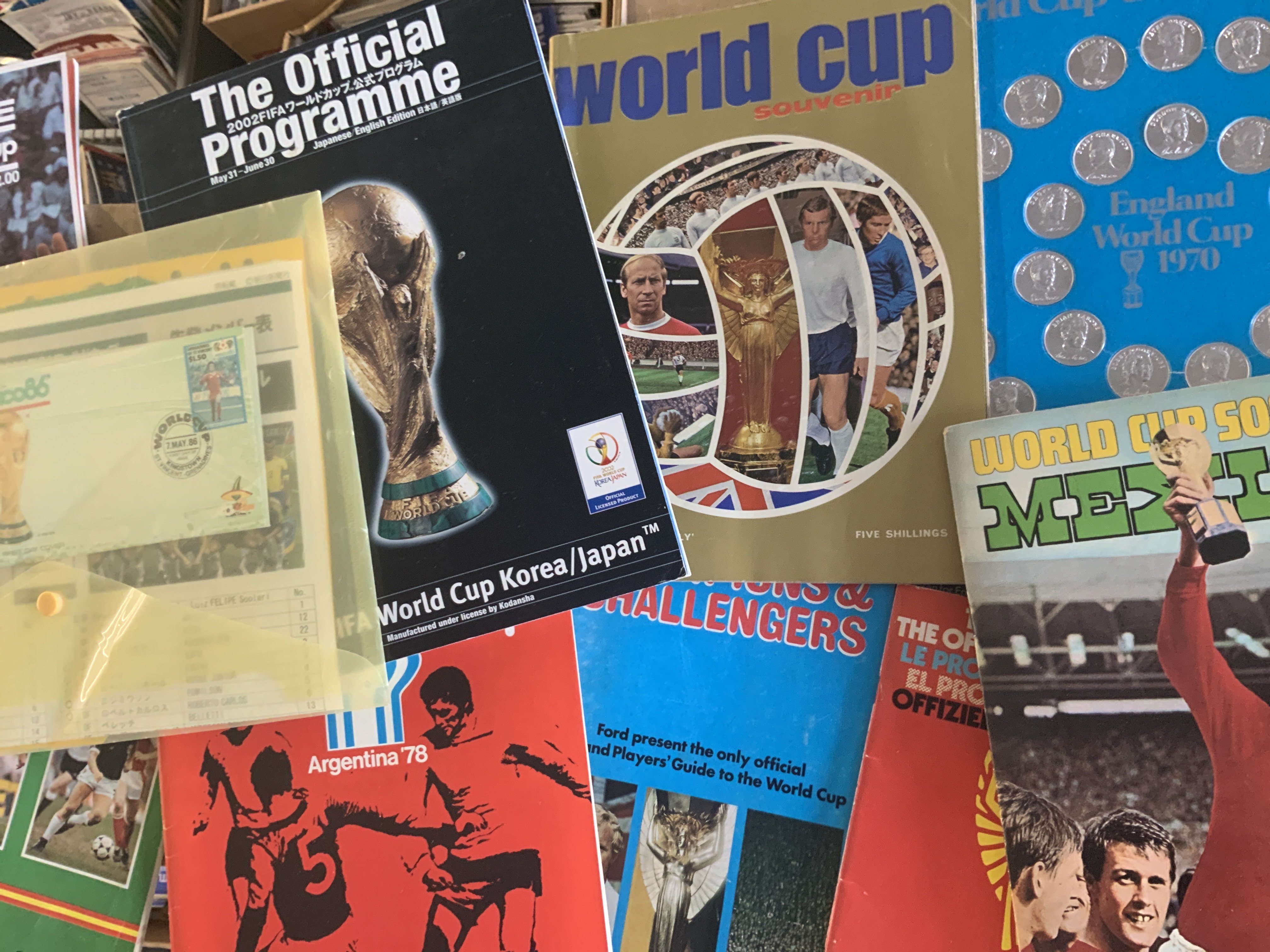 World Cup Football Memorabilia: From 1970 there is a coin collection, books, programmes, complete FKS sticker book. Other more recent World Cups covered with various publications. (29)