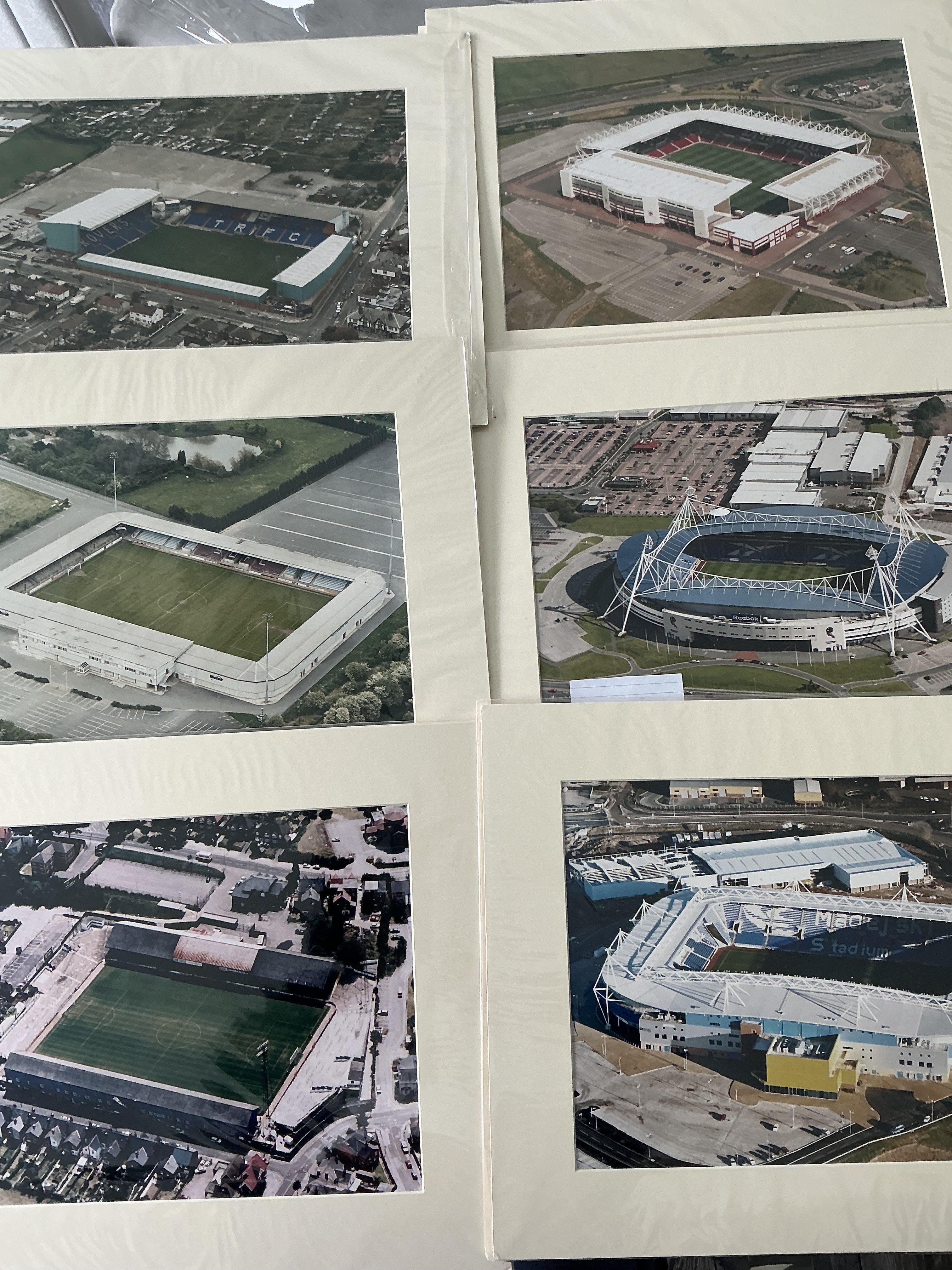Football Grounds Mounted Aerial Photos: 16 x 12 colour photos for teams which would look great in a man cave or to have in a football quiz. When taken these would have been Englands top 4 divisions clubs. Includes Wigan Tranmere Stoke Sheffield United Scunthorpe Reading Elm Park + Madjeski Port Vale Oldham and Bolton. Top quality large photos. (10)