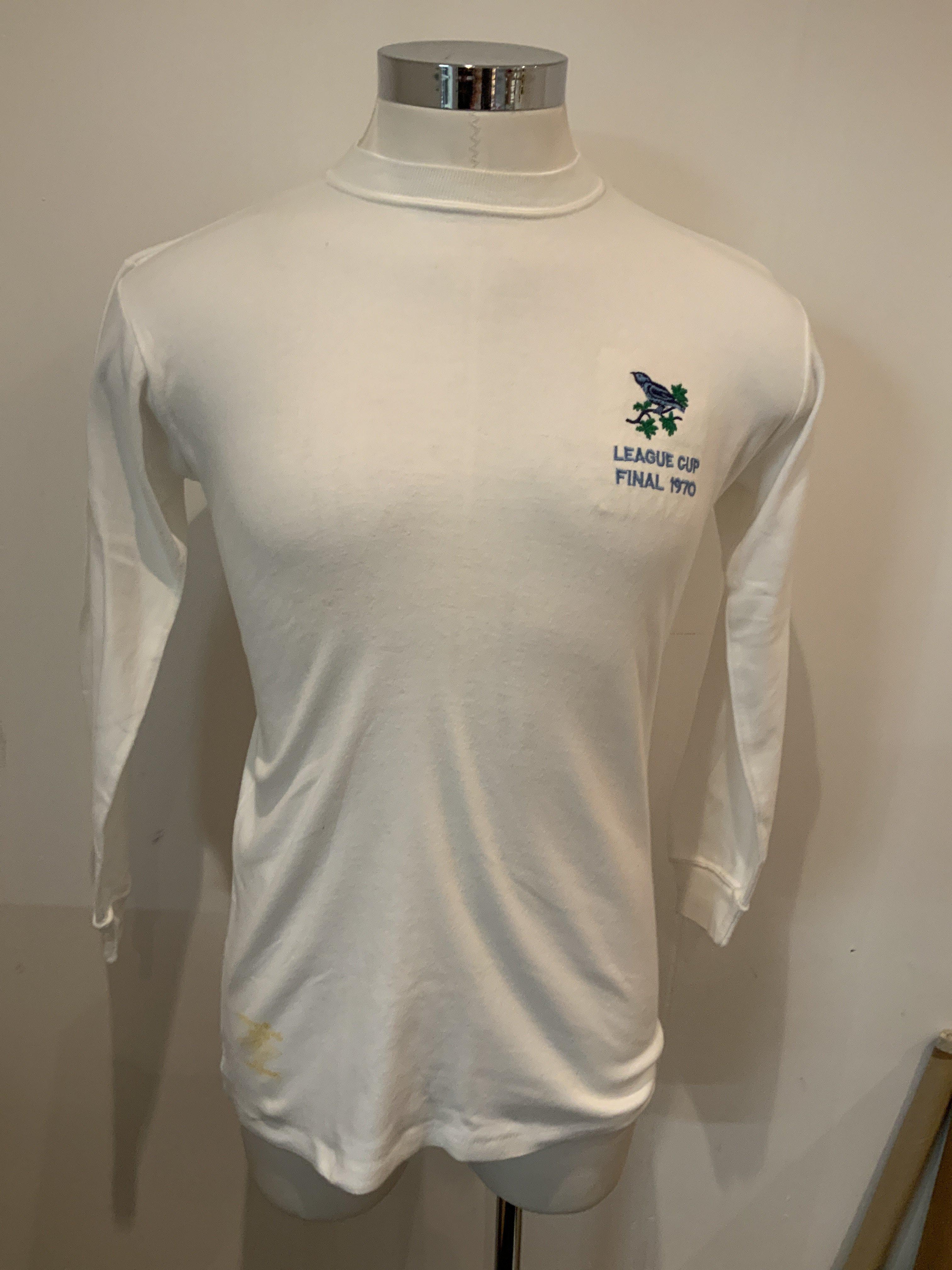 1970 West Brom League Cup Final Match Issued Football Shirt: Property of manager Alan Ashman who picked up a spare unnumbered shirt in the dressing room. Incredibly good condition direct from the family. COA from Laurie Rampling club historian and photographer who picked this up from the Ashman family. Includes original team sheet signed by Alan and given to Manchester City. There were only 3 team sheets ever produced.