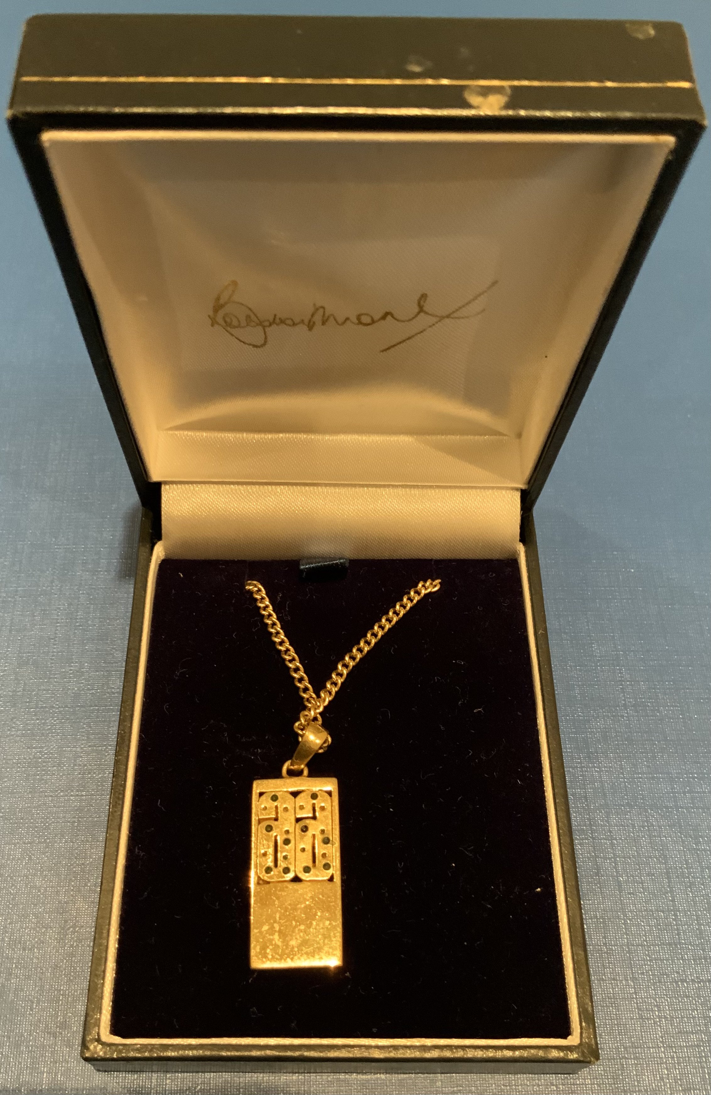 1966 World Cup Bobby Moore Boxed Jewellery: Necklace with pendant which has a sparkly 66 above a faint autograph of Bobby Moore and is engraved. Original box has Bobby Moores autograph embossed in lining. Believed to be made by Windsor and Allen for the Bobby Moore Fund. Attractive gold coloured item.