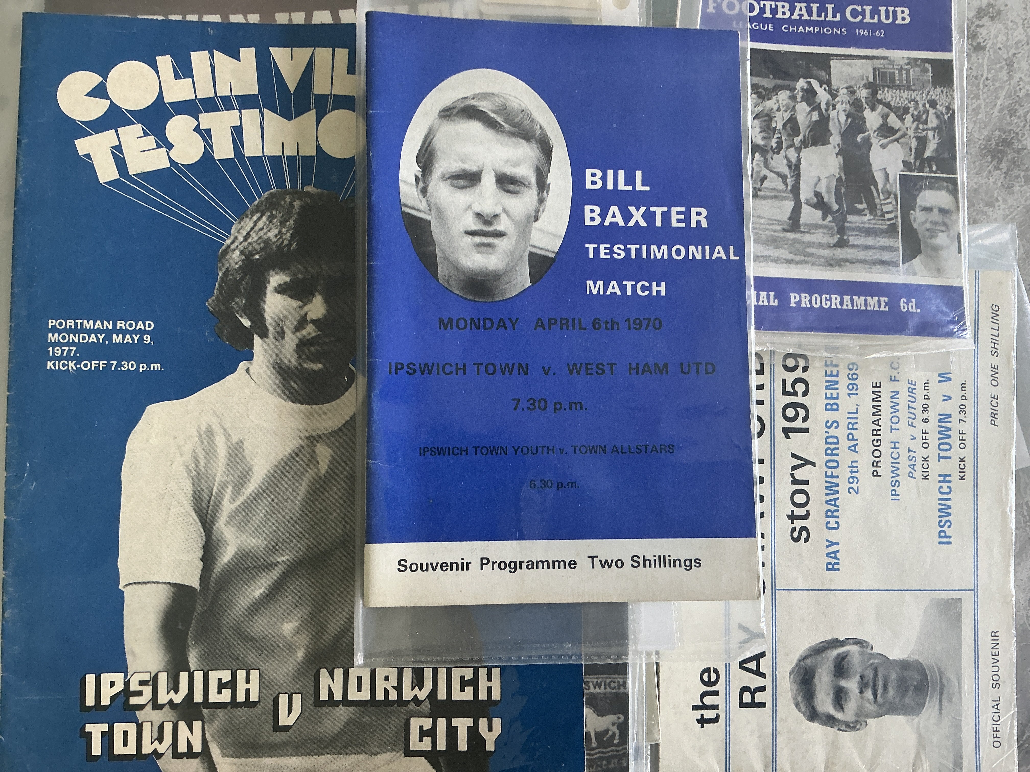Ipswich Town Home Testimonial Football Programmes: Includes 65/66 Arsenal (Ellsworth) and great names such as Baxter Crawford Harper Mills Viljoen Lambert Whymark Hamilton Robson Gray Beattie Hunter Sivell Wark newspaper version and many more. Collectors folder contains 26 programmes.