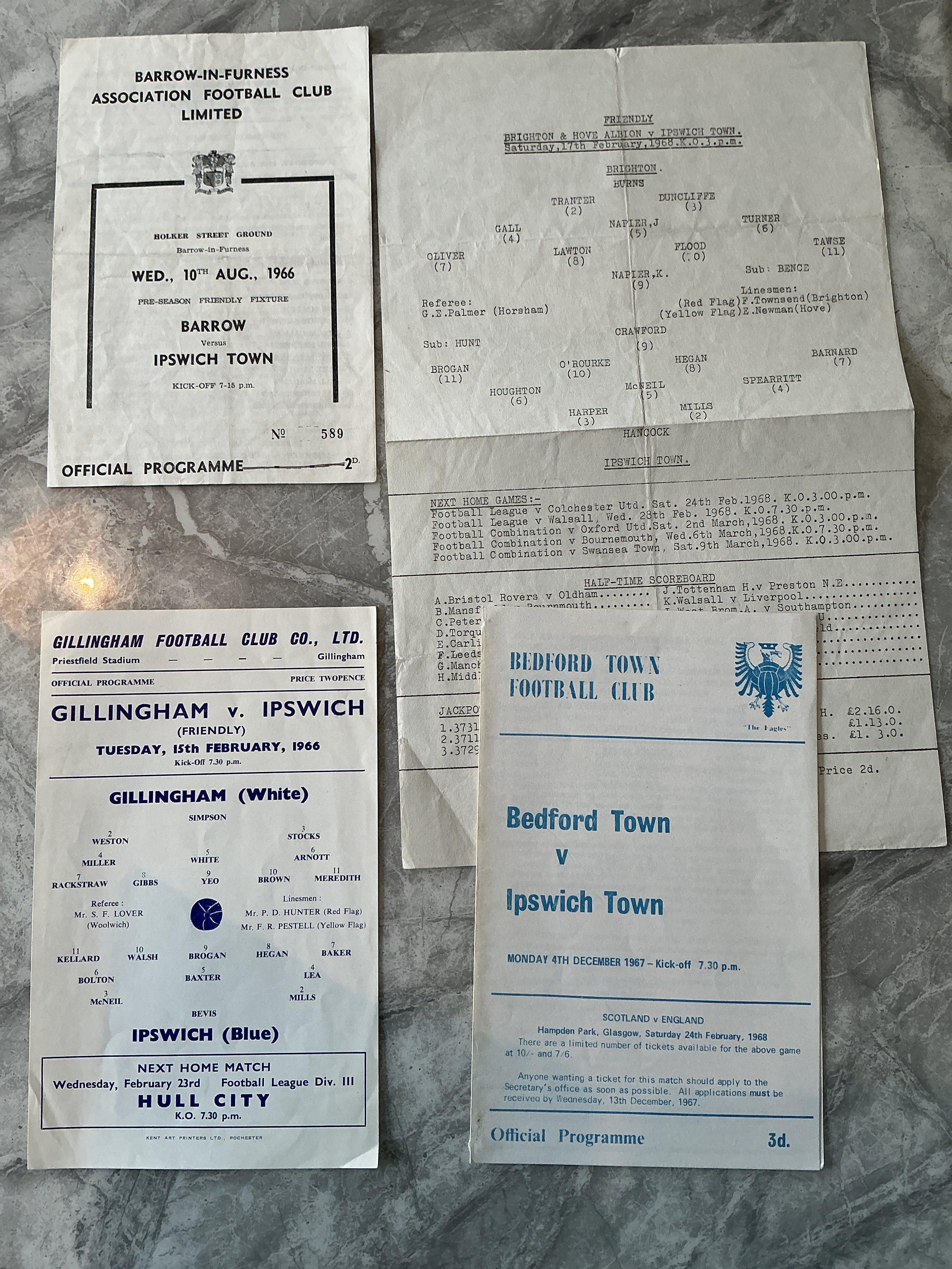 1960s Ipswich Away Friendly Football Programmes: 65/66 Gillingham, 66/67 Barrow, 67/68 Bedford, Brighton. Good. (4)