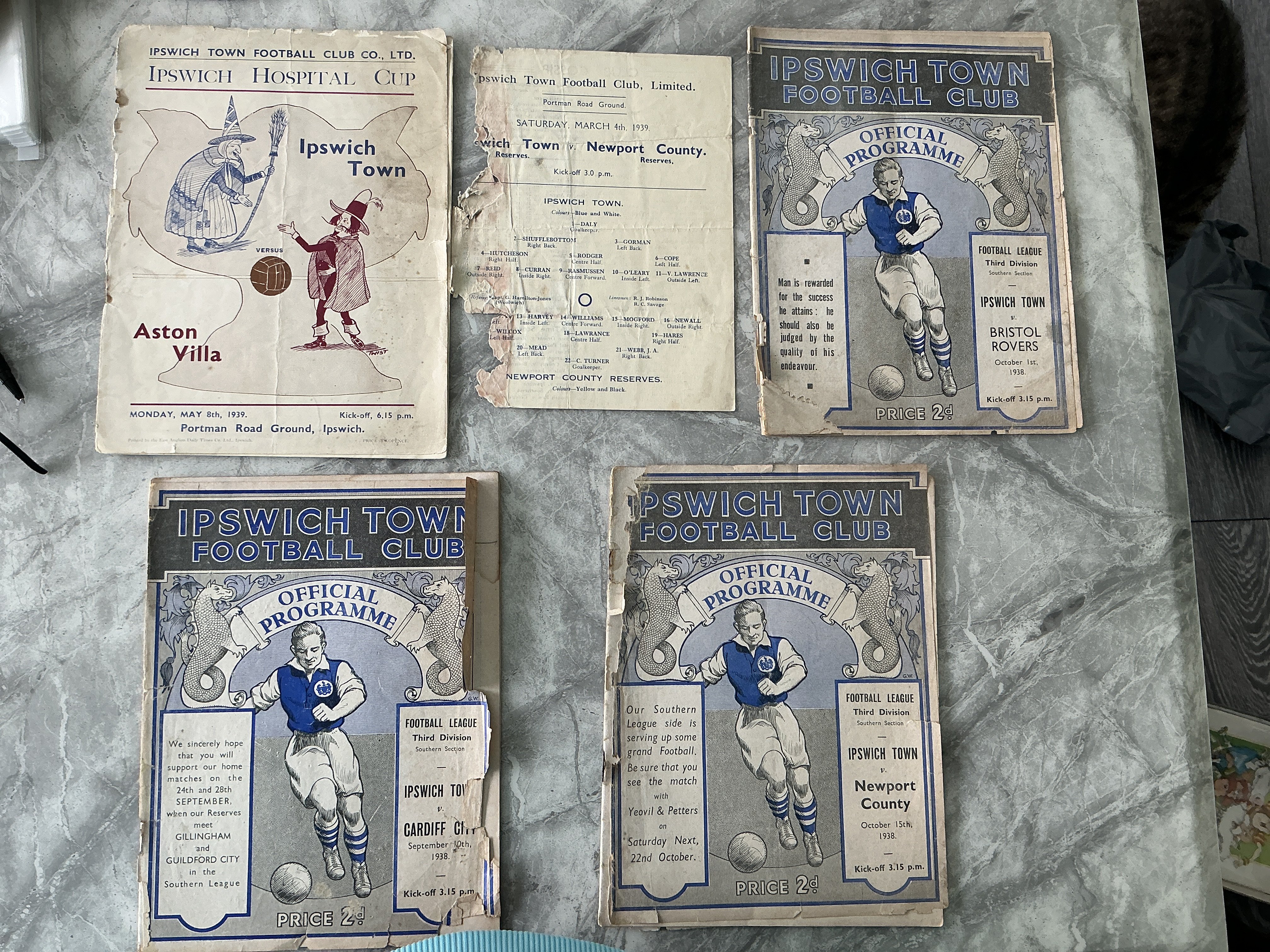 Ipswich Town Home Damaged Pre War Football Programmes: 37/38 Colchester split spine + tear, Dartford rust marks, 38/39 Aston Villa no back cover, Newport reserves pieces missing, Bristol Rovers pieces missing from back page, Newport covers loose and pieces missing,, Cardiff no back cover. Very poor. (7)