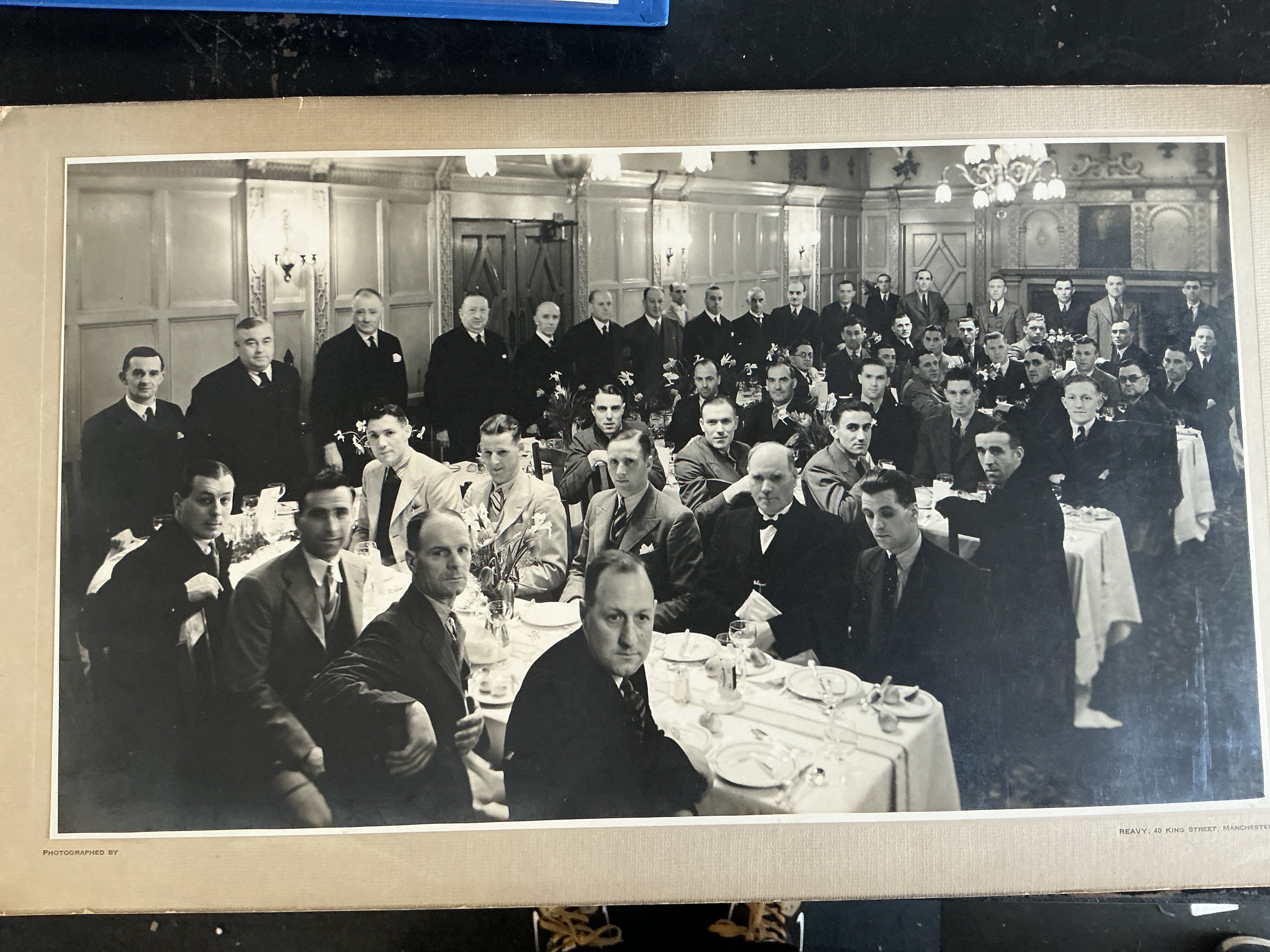 Manchester United 35/36 Promotion Large Photo: Official players large card measuring 20 x 12 inches. Pictures the team and staff at a celebration promotion dinner as Man Utd were promoted to Division 0ne.