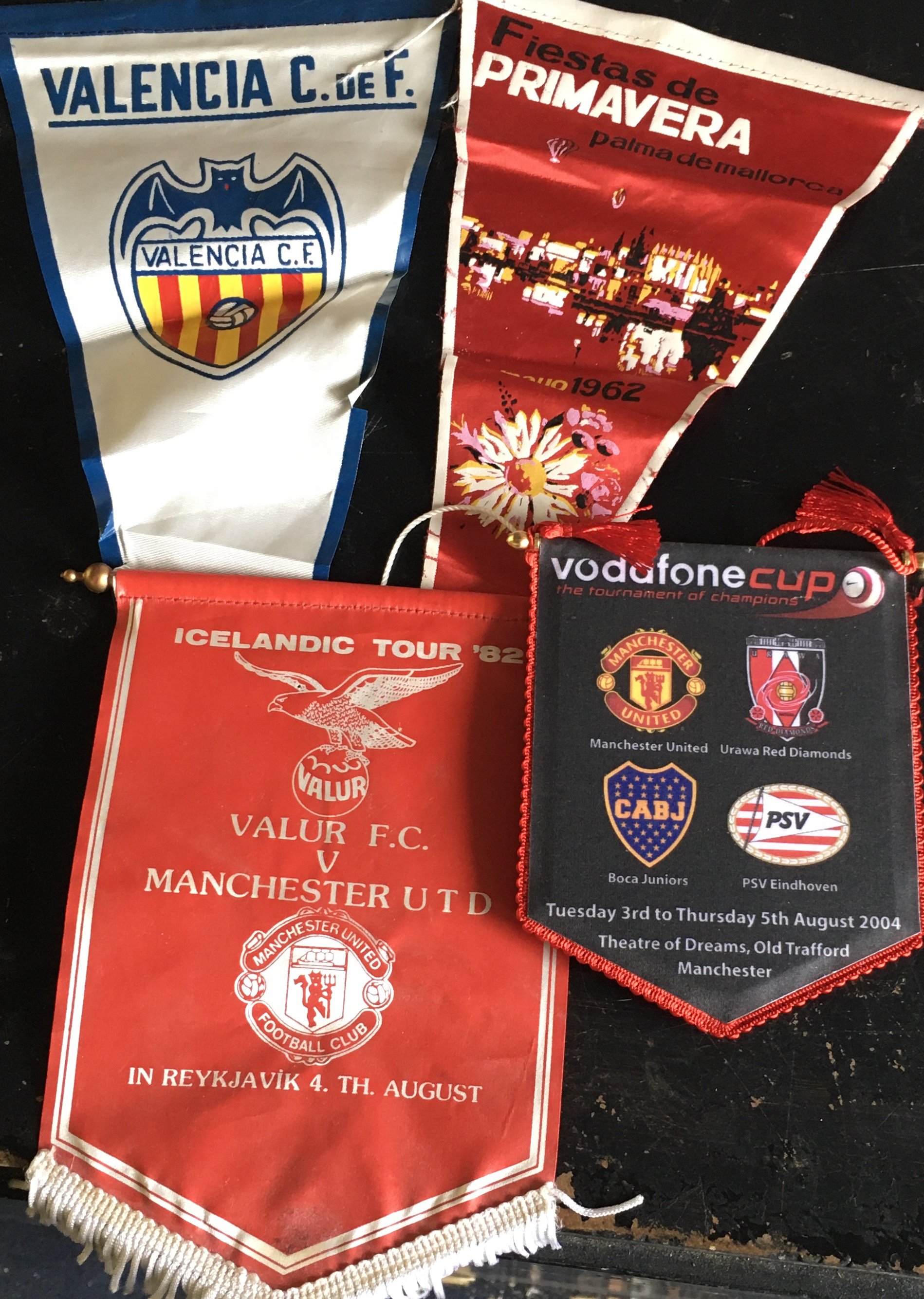 Manchester United Football Pennants: Four pennants from Manchester United tours featuring Palma in 1962, Valur Iceland 1982 Vodaphone cup 2004 and an undated Valencia. (4)