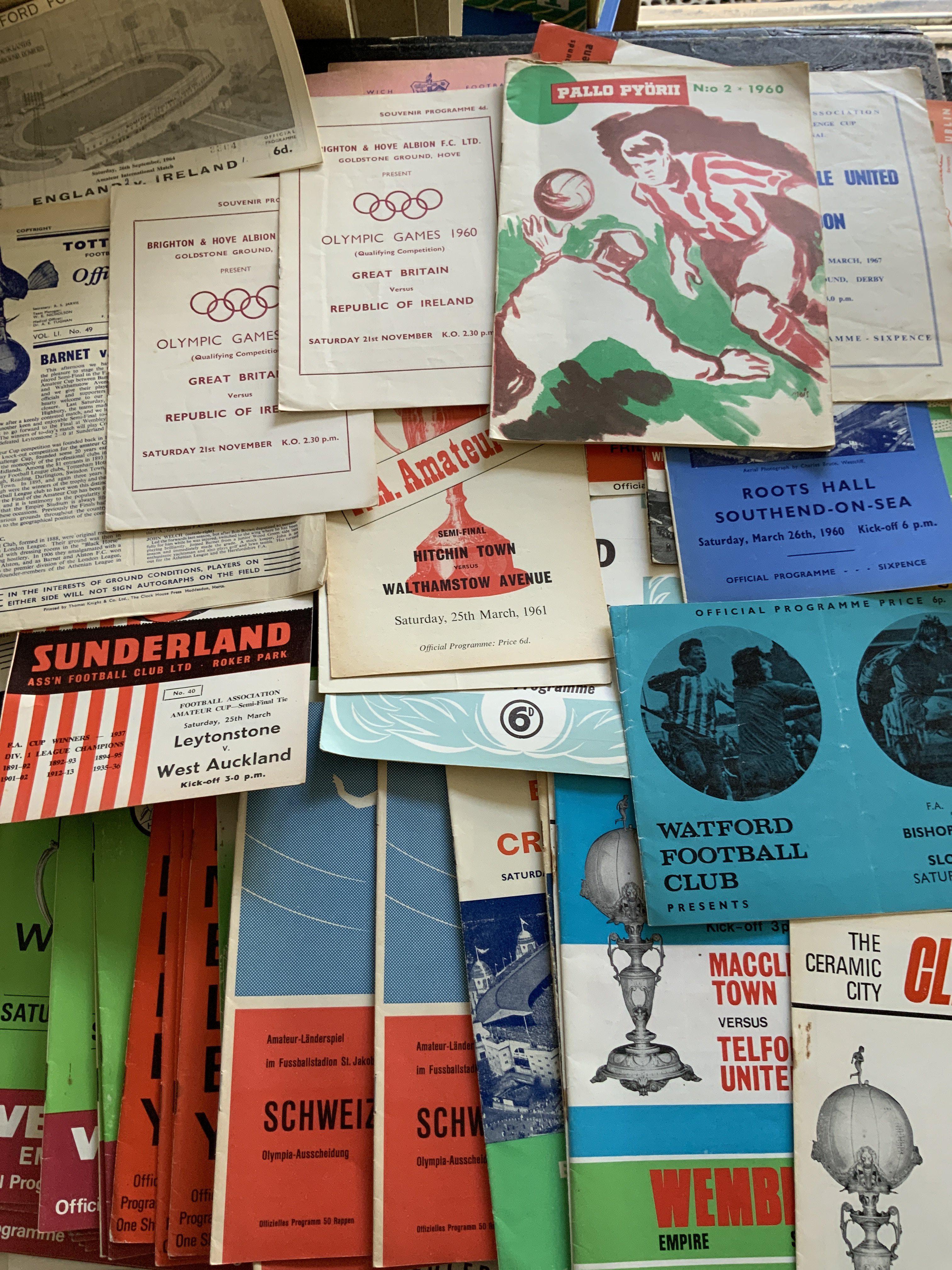 Amateur Football Programmes: Many from the 60s to include Olympics, Amateur Cup semis and finals, Amateur Internationals and more. Heavy duplication with 59/60 Gt Britain v Netherlands at Tottenham x 7, Switzerland v Luxembourg x 5, 60/61 Gt Britain v Ireland at Brighton x 2. Worth a look as some nice Amateur Cup semi finals played at Sunderland Stoke and many more. (100+)