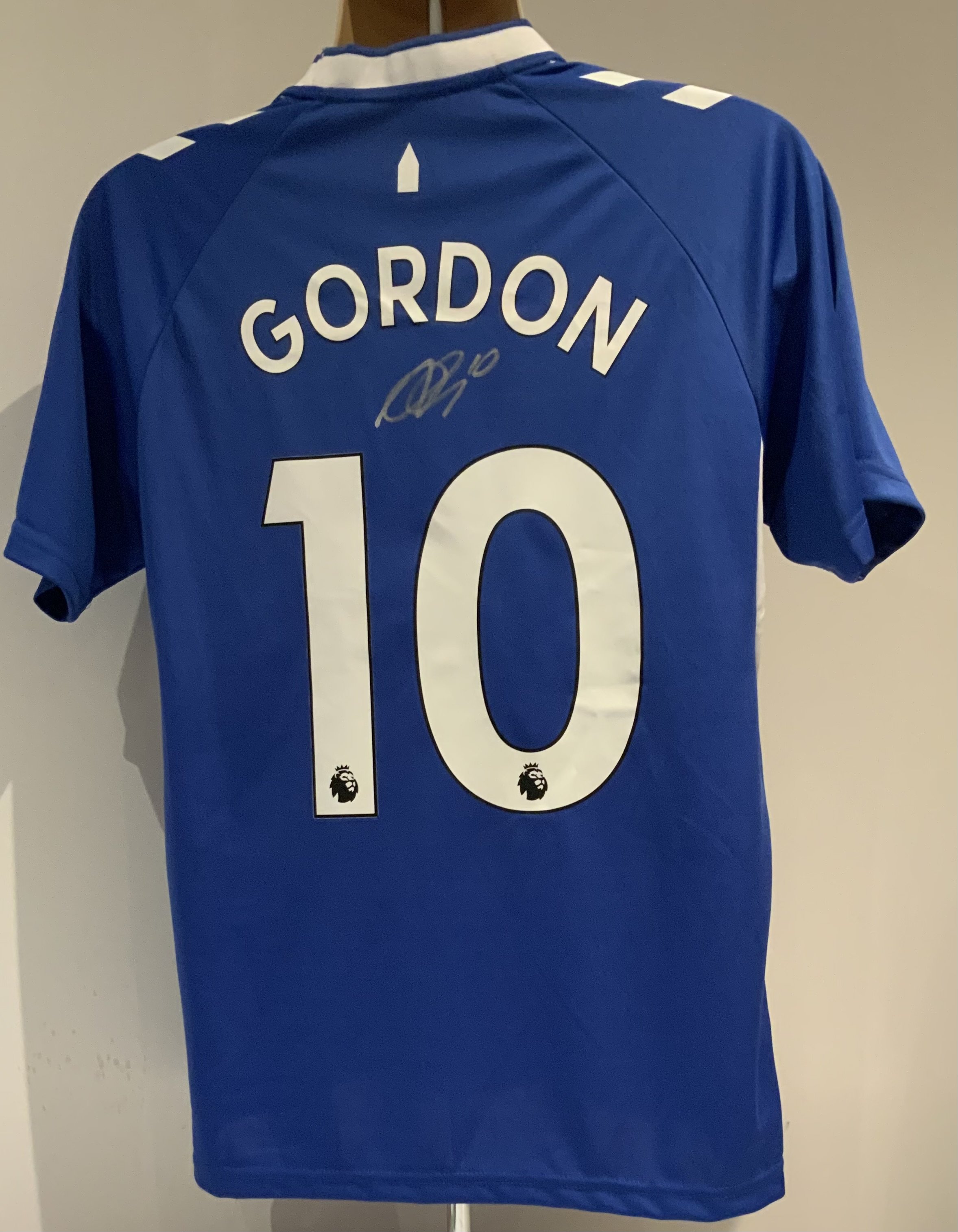 Everton Gordon Signed Replica Football Shirt: Hummel short sleeve name and number shirt with tags signed to rear by the player with an additional two signatures to the front.