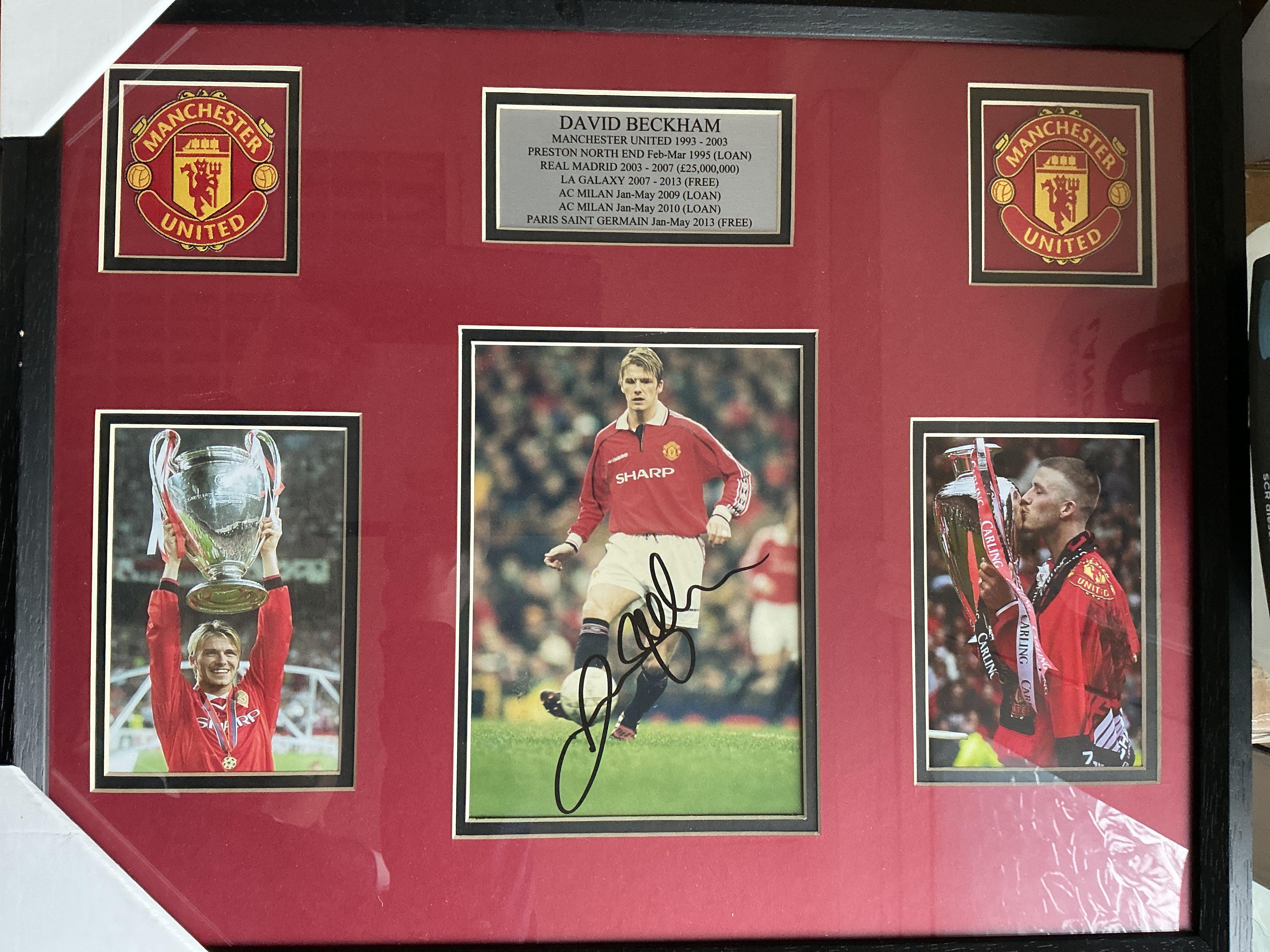David Beckham Signed Framed Manchester United Photo: Treble season photos nicely framed with clear undedicated signature. COA to rear. Measures 21 x 17 inches.