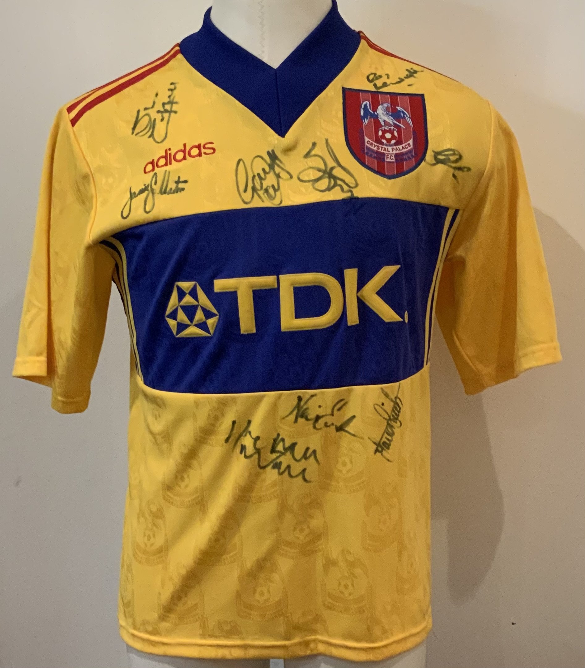 Crystal Palace Signed Football Shirt: Crystal Palace 96/97 season multi signed replica away shirt with 9 signatures. Includes Ray Houghton, Neil Shipperly, Gareth Davies plus others. Good condition.