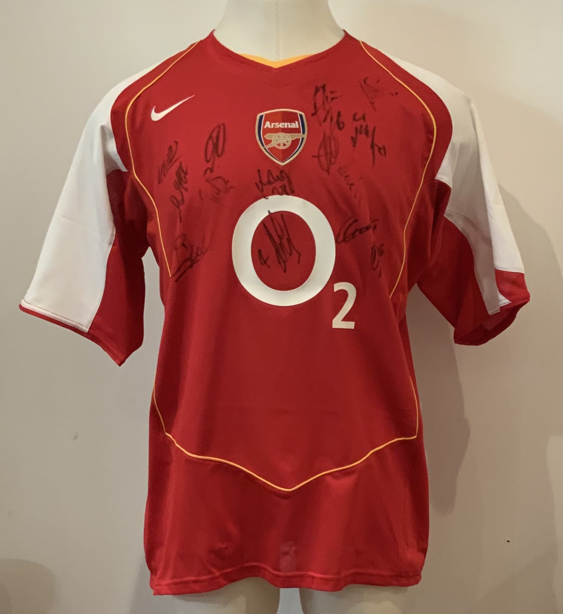 Arsenal 2004 - 2005 Squad Signed Football Shirt: Short sleeve Umbro shirt signed to front by 13 players. Good condition. Arsenal were FA Cup winners this season and Premiership runners up.