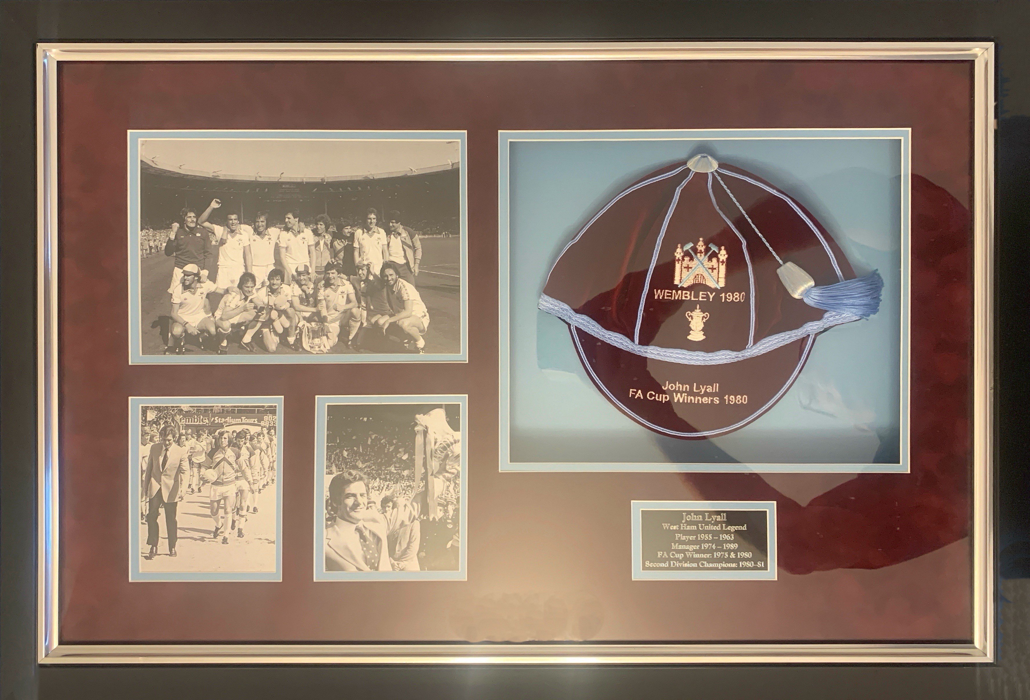 West Ham 1980 FA Cup Winners Football Cap: Stunning framed cap in a quality 800 x 550mm frame which includes photos of the team plus Lyall with trophy and leading the team out. COA from Gentlemen and Players caps who along with Tony Gale presented the cap on 11 10 2018 to the family of John Lyall.