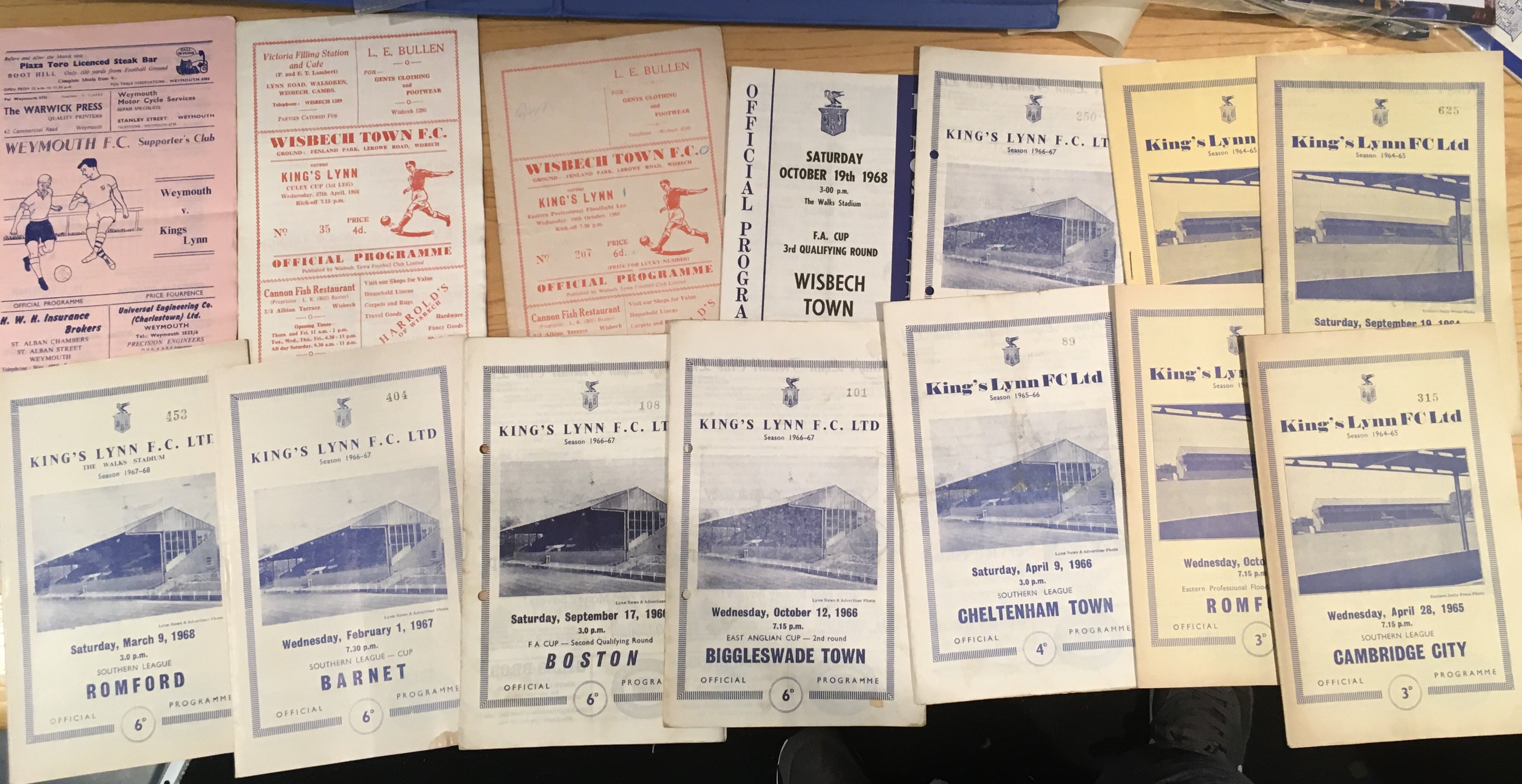 Kings Lynn Football Programmes: 14 home and away from the 60s in overall fair condition and some homes from 2024/2025. C/W first ever handbook from 68/69 in fair condition.