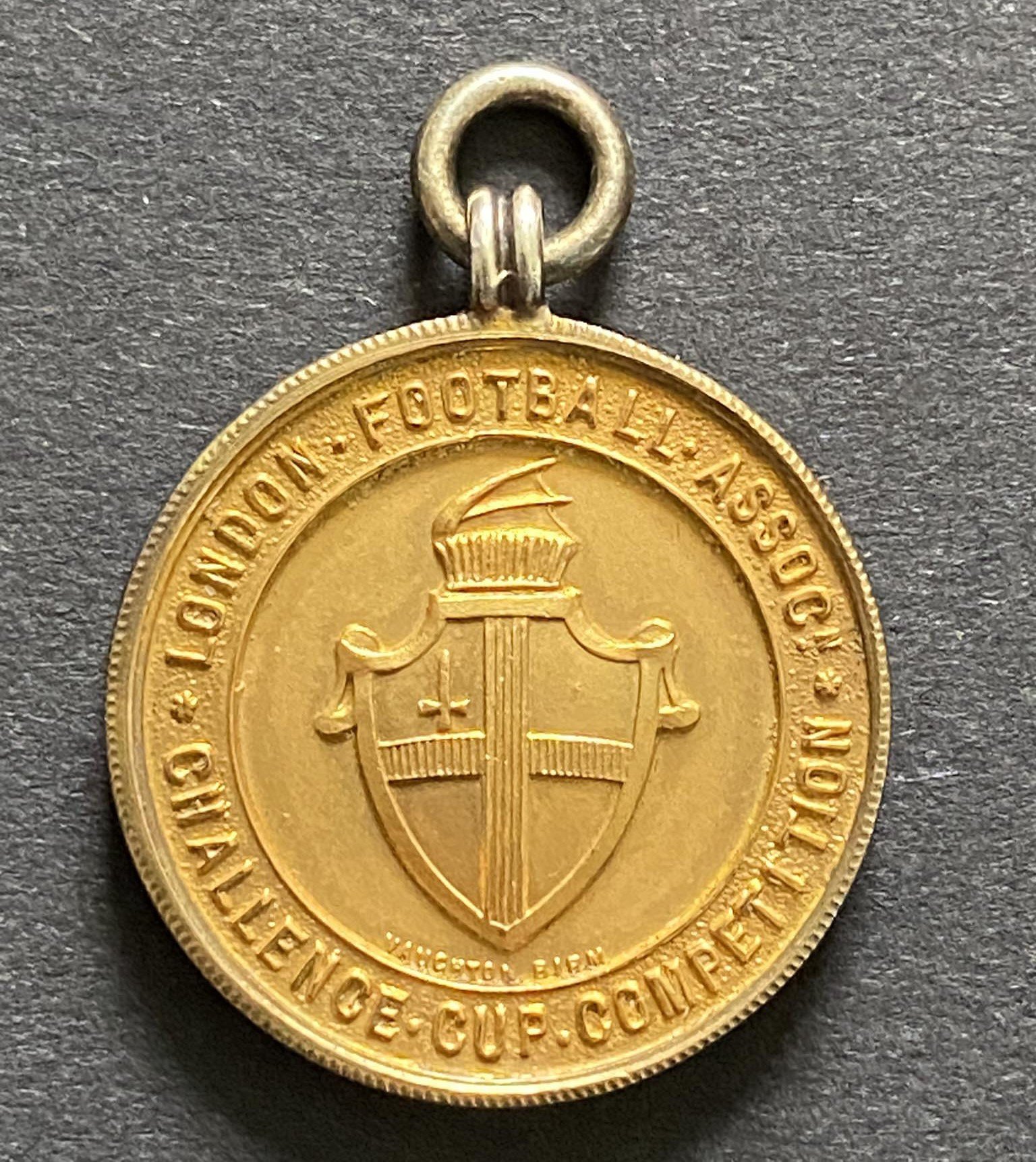 John Lyalls West Ham London FA Cup Football Medal: Quality silver gilt medal in original Vaughtons + Sons box. West Ham were runners up after being defeated by Arsenal on 17 3 1958 at Upton Park.