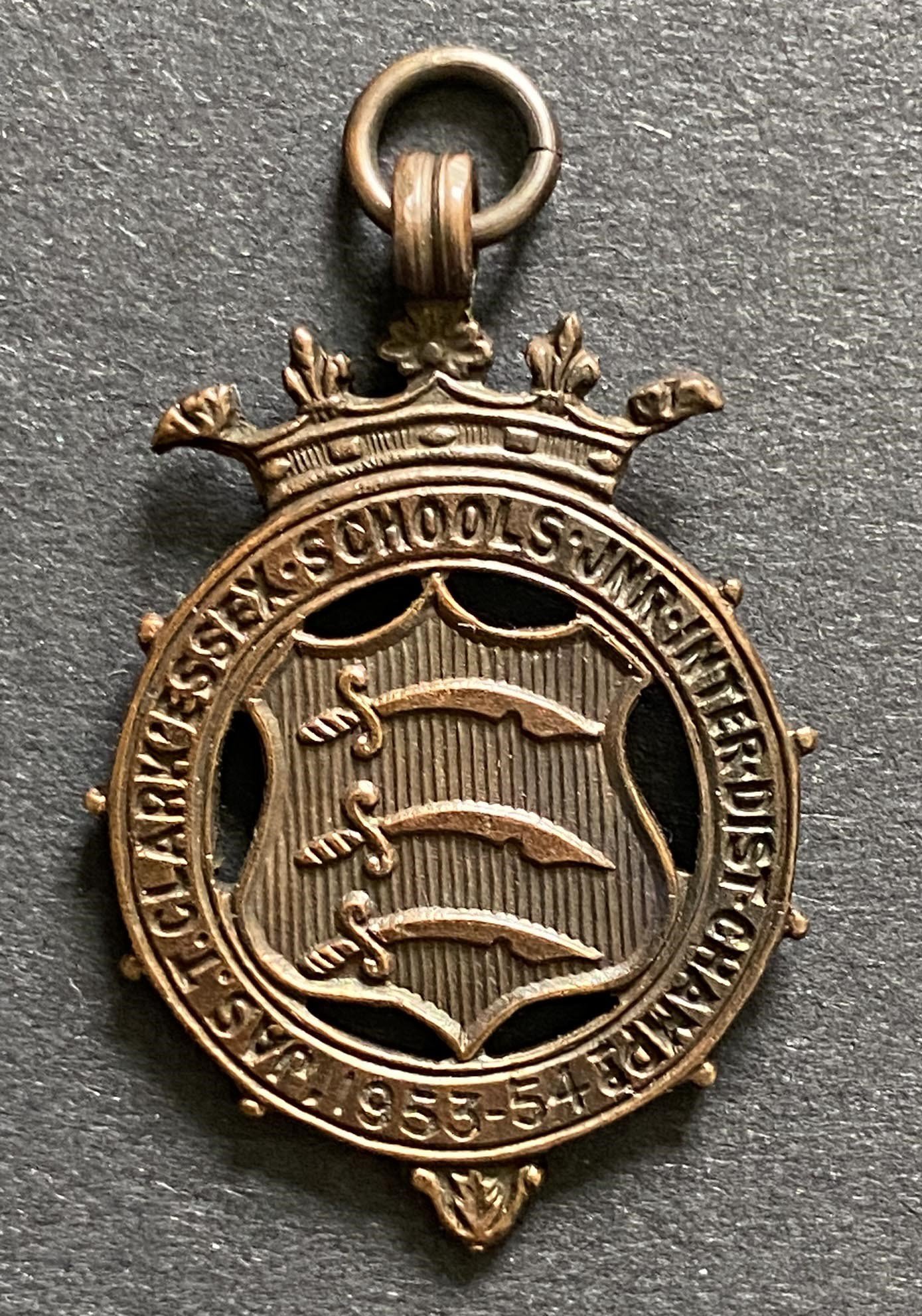 John Lyalls Essex Schools Medals: Jas T Clarke medal for the 53/54 Essex Schools U14 final where Lyalls Ilford lost to Walthamstow Avenue at Green Pond Road. C/W his 54/55 Inter District winners medal. (2)