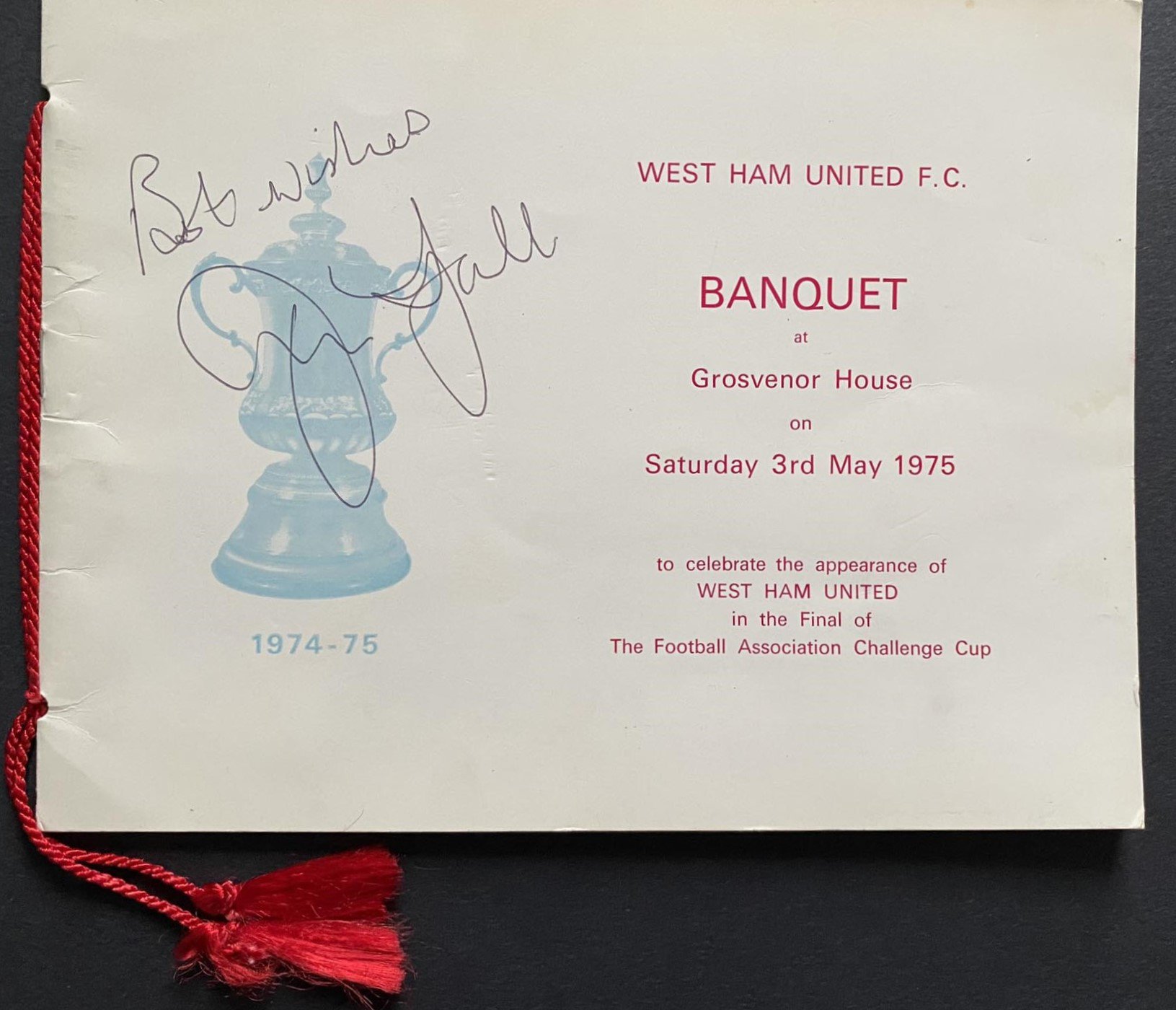 John Lyall`s 1975 FA Cup Final Football Momentos:  A signed copy of the Grosvenor Banquet Brochure, Final programme signed by Lyall plus goal scorer Taylor inside and a ticket stub with photograph also signed by Alan Taylor.  It also contains John Lyall`s personal copies of both 1975 FA Cup semi-final programmes and the ticket stub from the Chelsea match used by his son (the vendor).