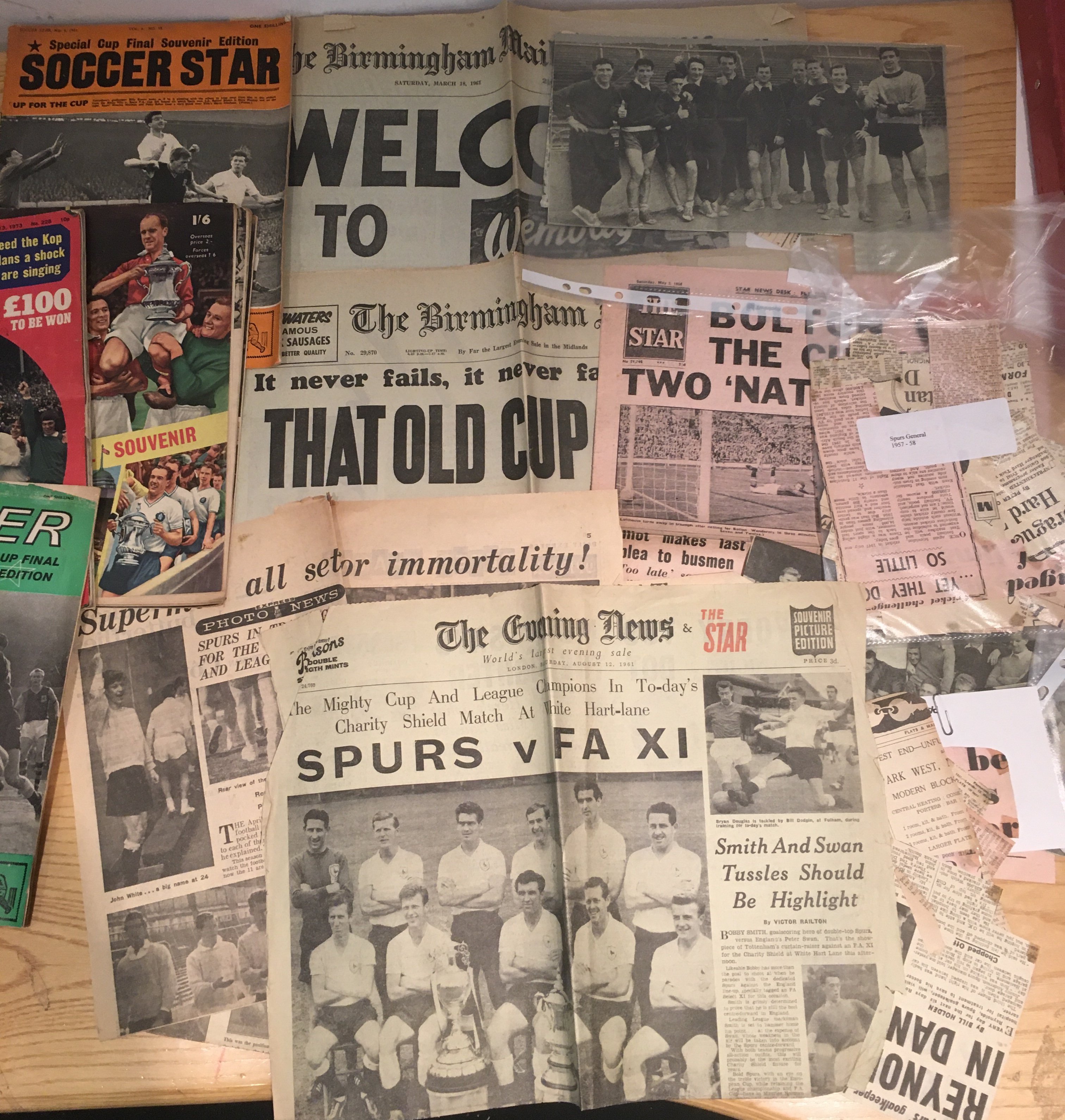 Tottenham Football Memorabilia Box: Includes newspapers and cuttings which feature FA cup semi finals, Charity Shield. 39 Team sheets, magazines, videos, calendars, posters. Tottenham victory cards in official binders 2002-03 to 2005-2006. 1960 supporters club membership card. Worth a look.