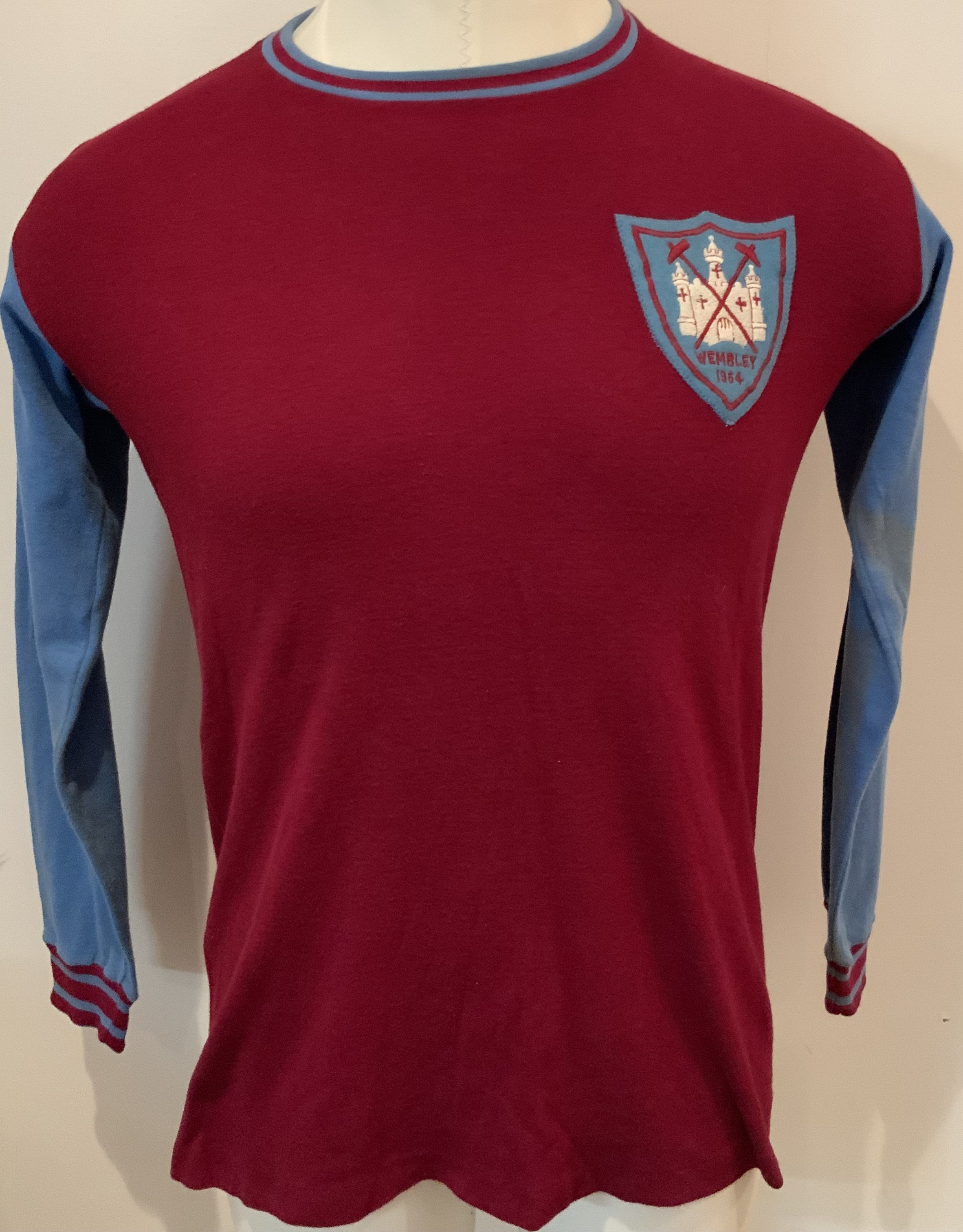 Ron Boyce West Ham Match Worn 1964 FA Cup Final Shirt: Bukta shirt in excellent condition worn in the final V Preston. Ron Boyce famously scored the winner to give West Ham their first FA Cup success. A truly iconic piece of West Ham history. COA will be supplied by the family of Boyce. Some slight staining to cuffs and sleeves of shirt.