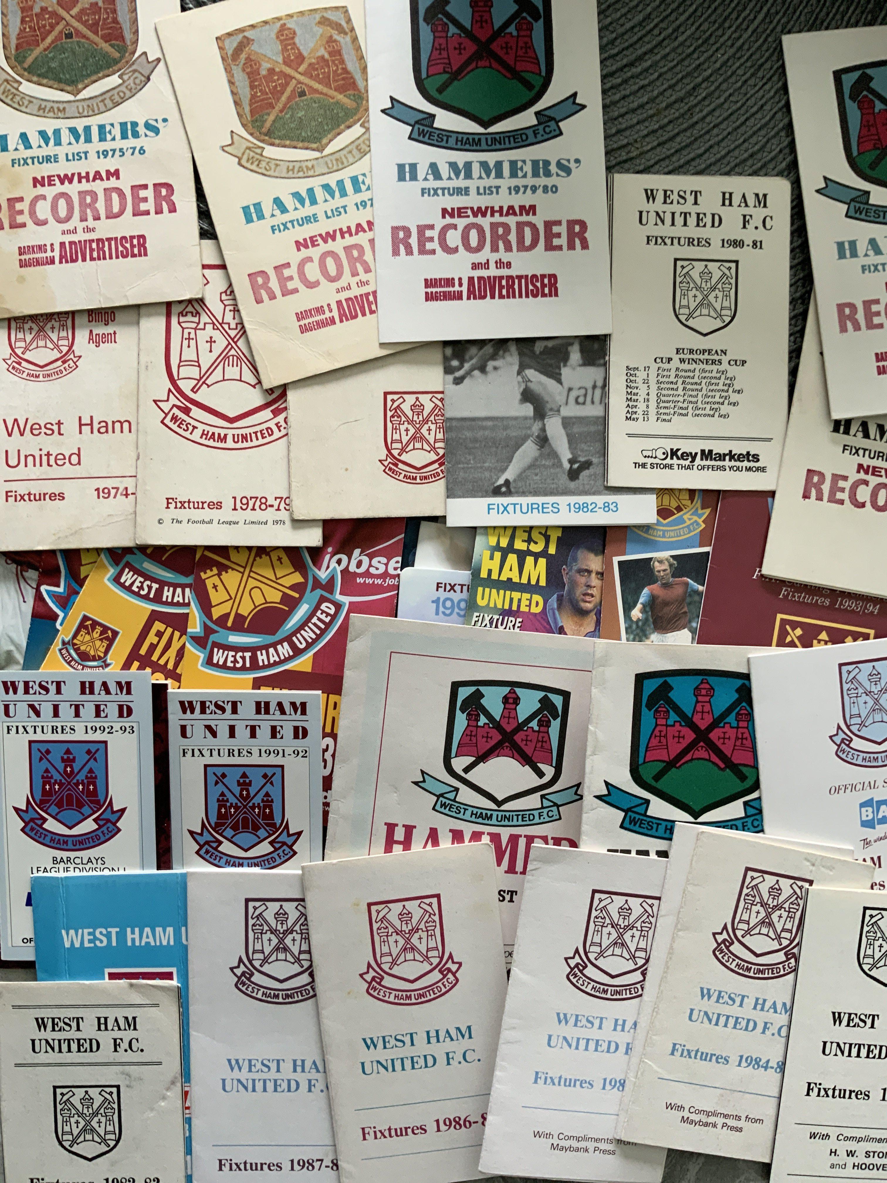 West Ham Football Memorabilia Box: Books including a signed undedicated Billy Bonds, 2 signed Geoff Hurst photos including one by Autographed Editions, large quantity of fixture lists from the 70s onwards, 28 handbooks from 1958 - 2006 and more. (box)