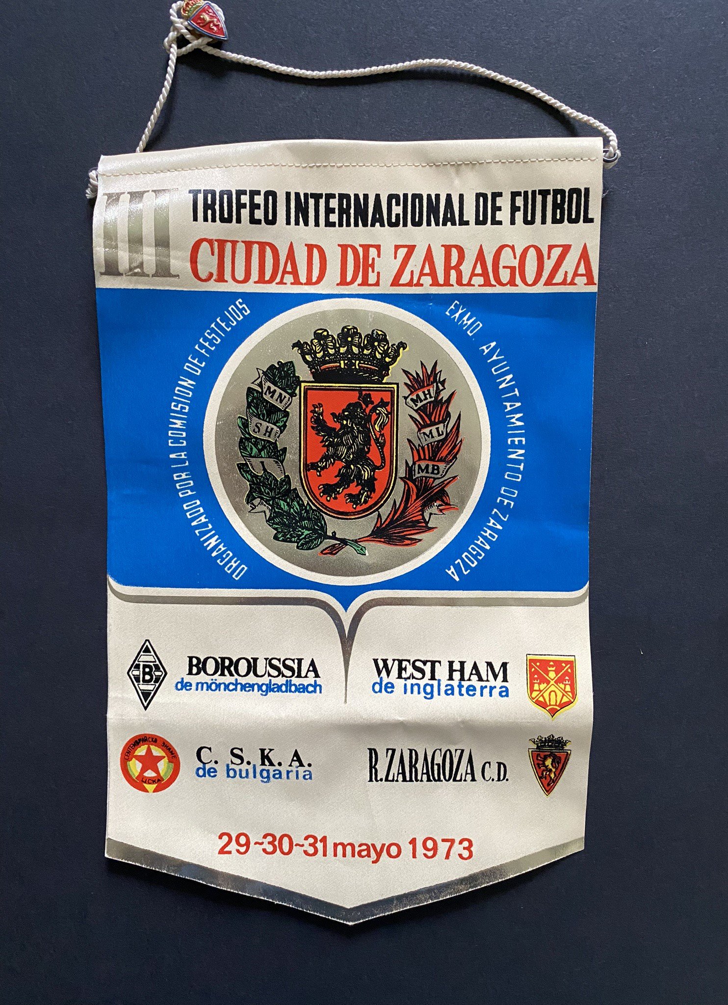 John Lyalls West Ham v Real Zaragoza Football Mementos: 1973 tour pennant given to Lyall which has the participating teams and date on it. Both these teams plus CSKA and Monchengladbach also mentioned. C/W a further pennant and badge thought to be picked up when the teams met in the ECWC semi final in 1965. (3)