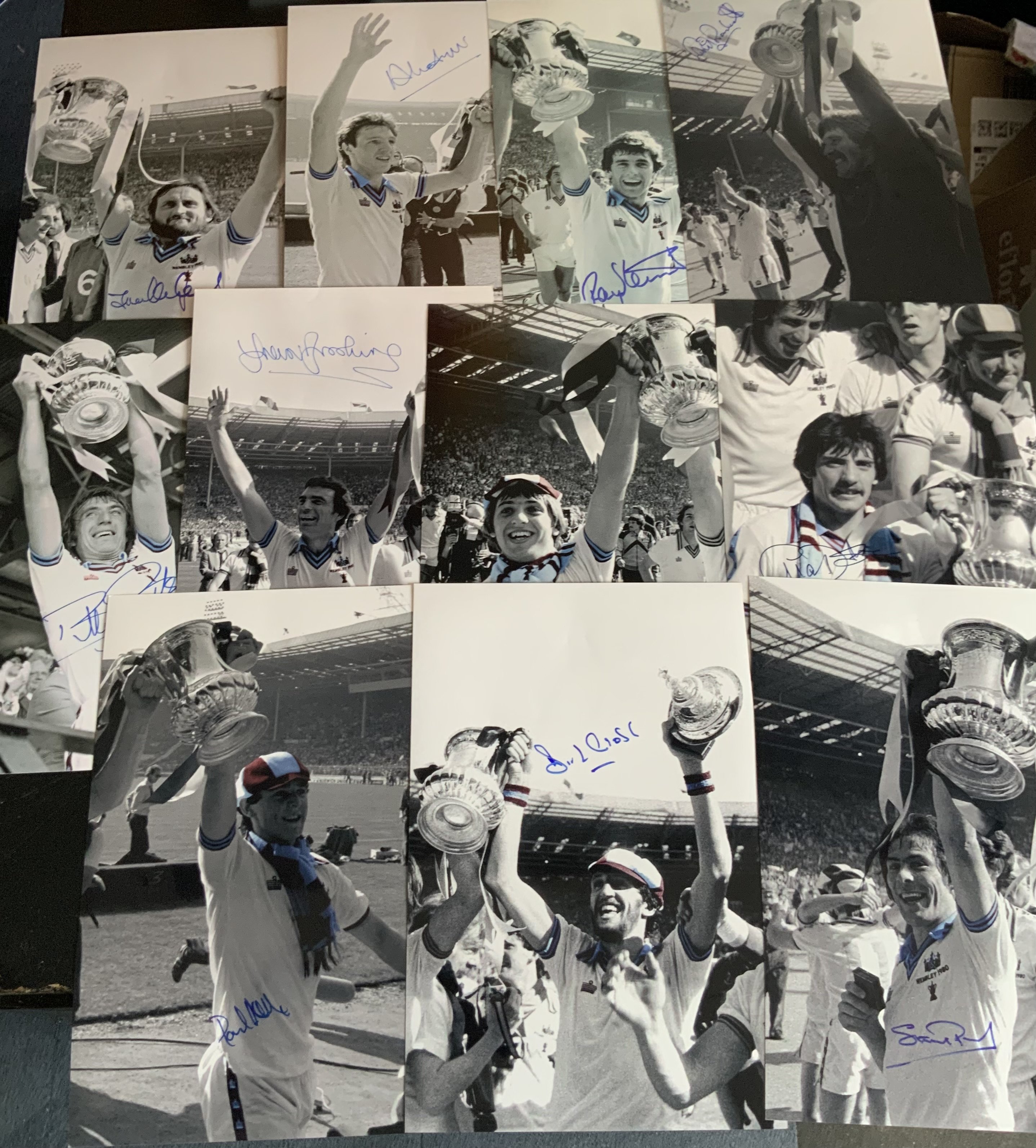 1980 West Ham FA Cup Winners Signed Football Photos: Quality 12 x 8 inch photo of each player on that day in black and white with claret and blue cleverly coloured. Each photo shows the player celebrating mostly with the cup and are hand signed. (11)
