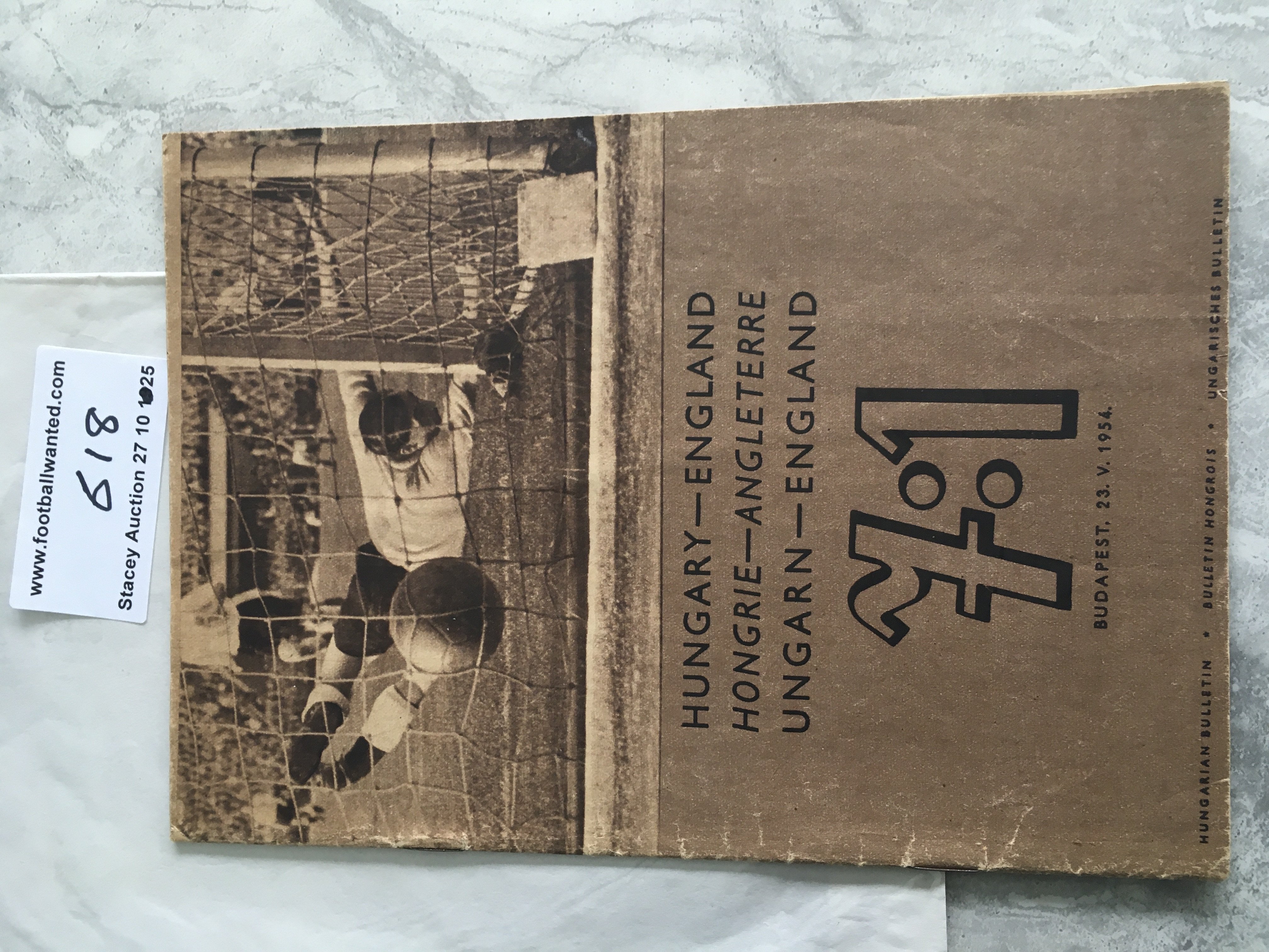 1954 Hungary v England Football Magazine: Hungarian Bulletin magazine with all 24 pages featuring photos of the incredible 7-1 victory over England. Not to be confused with programme this is a blow by blow guide from teams entering the field to line ups, captains shaking hands goals etc. Excellently produced just after the match with captions in Hungarian and English.