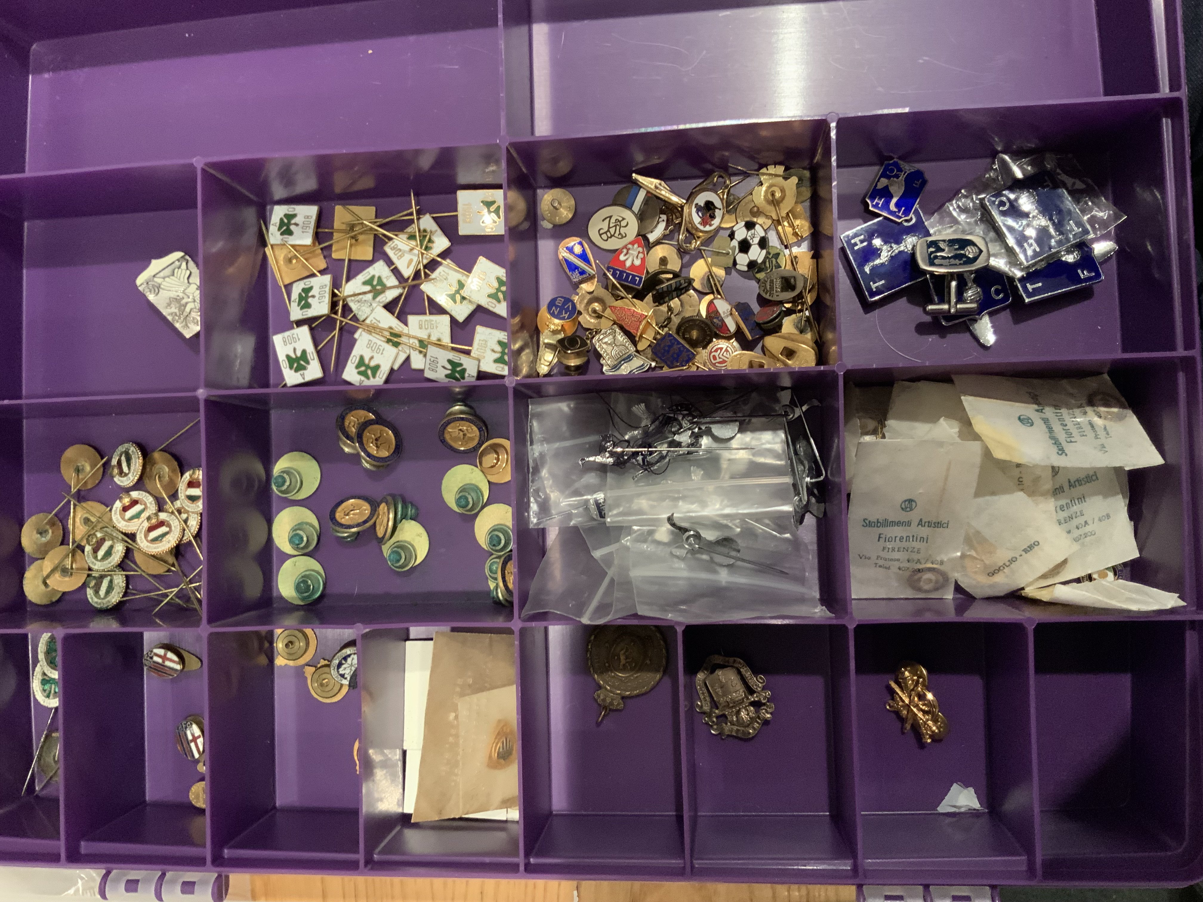 Football Badge Collection: Must view as badges appear old. Lot of Tottenham to include quantity of one style plus lapel badge etc. Quantity of each of the same Hungary and Italy badge plus International Soccer badge San Francisco which could refer to English club tours in the 60s. Possibly Panathinaikos as well in quantity. Spotted in this badge case a madras which states 1899 to 1949 celebrating 50 years of defunct Belgium team Beerschot.