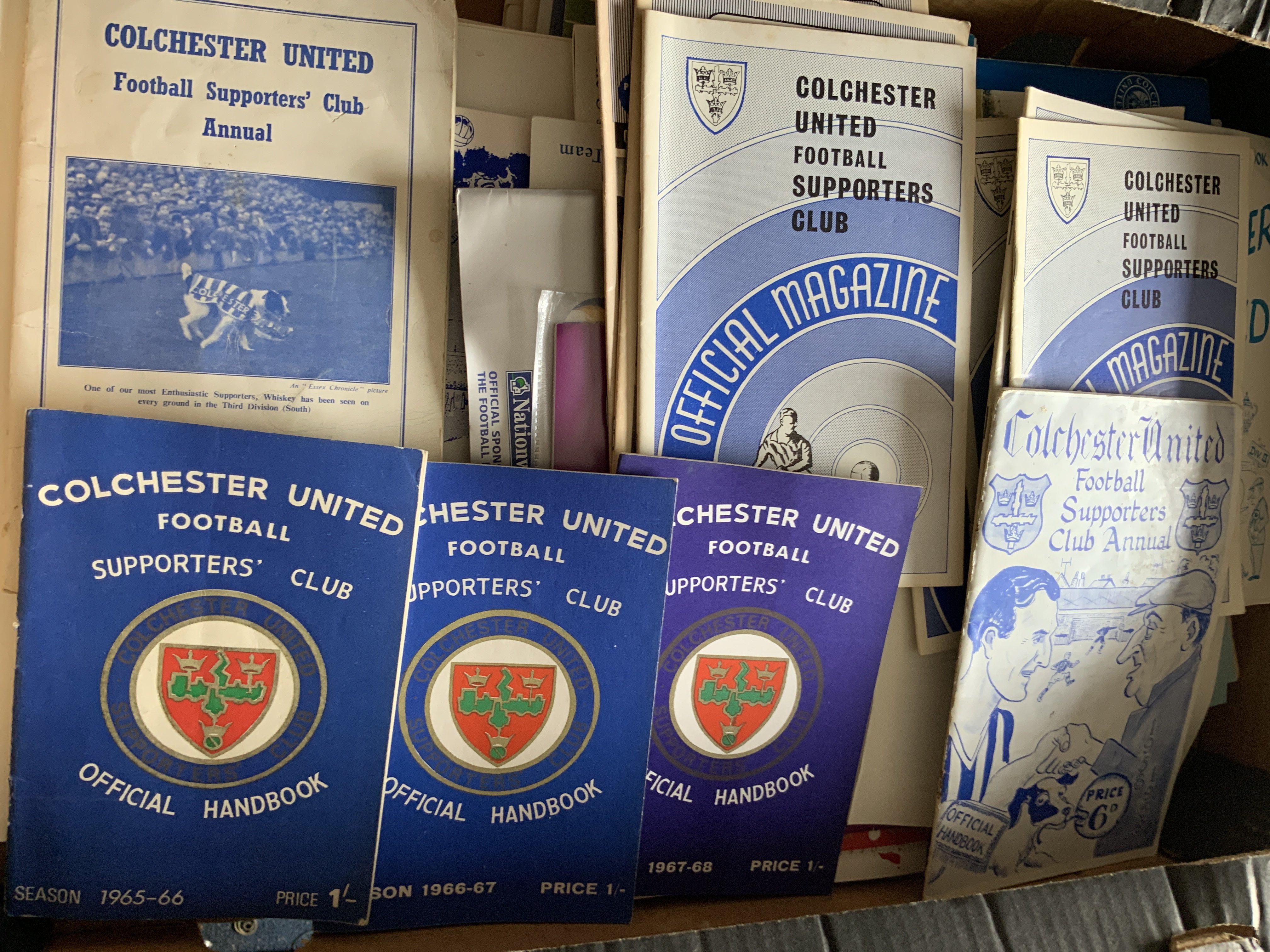 Colchester United Football Memorabilia: 8 large press photos mainly with stamps to rear with 6 from the famous match v Leeds in 1971. C/W some programmes and handbooks.