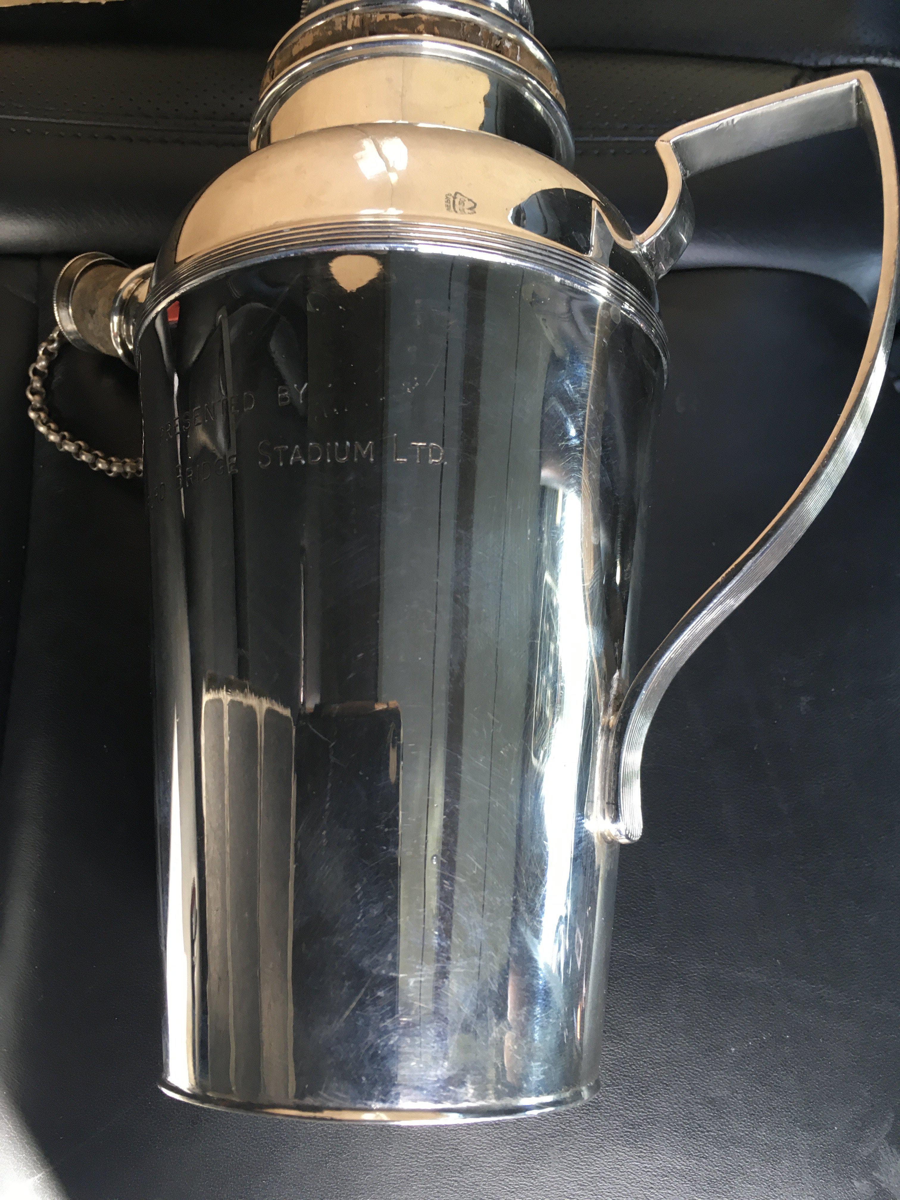 Chelsea Pre War Football Gift: Silver plated 9 inch high jug which is like a flagon has the words Presented By Stamford Bridge Ltd engraved. Good condition.