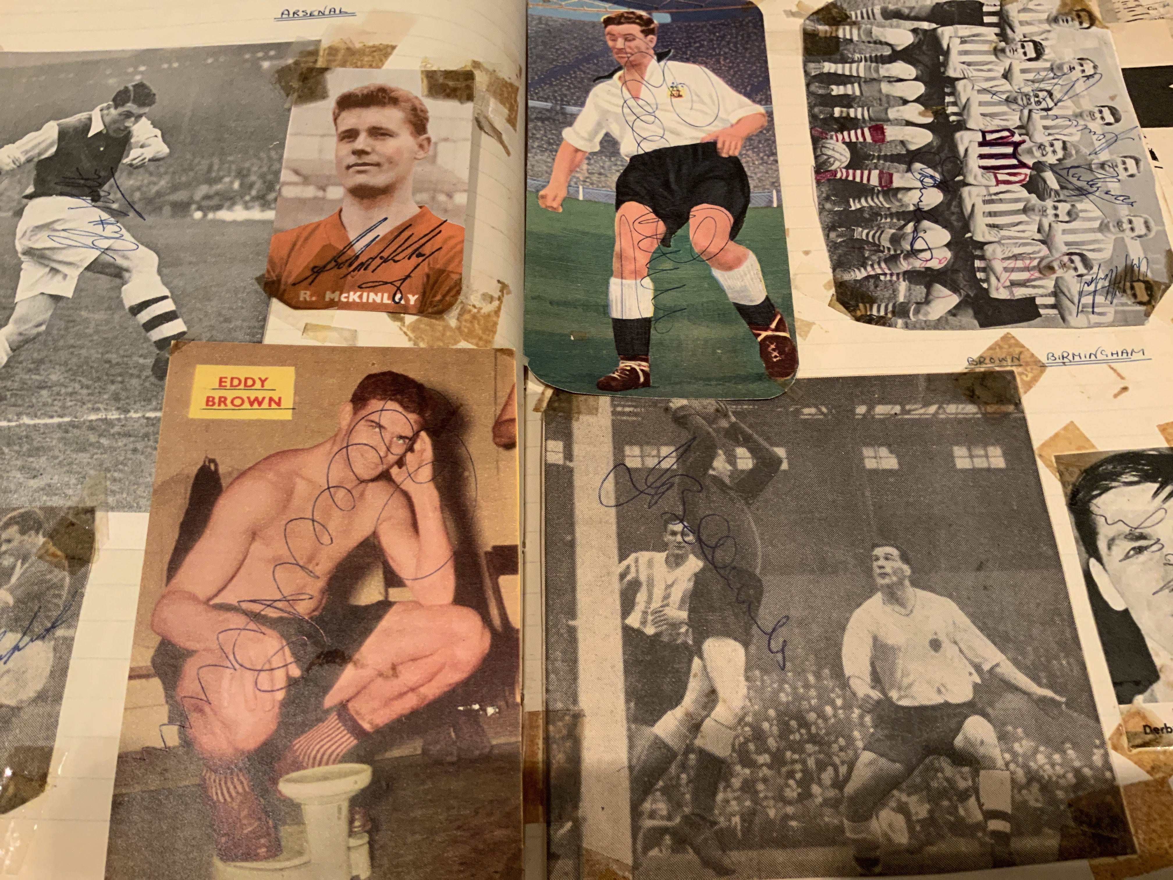 Signed Football Scrapbook: Quantity of hand signed undedicated autographs on various size magazine pictures. All have been stuck into scrapbook and have tape marks to corner and most have come loose so with a little trim you could lose the tape marks. The majority are late 50s and 60s with some great names to include an Everton 1960s team group signed by 15. Worth a look.