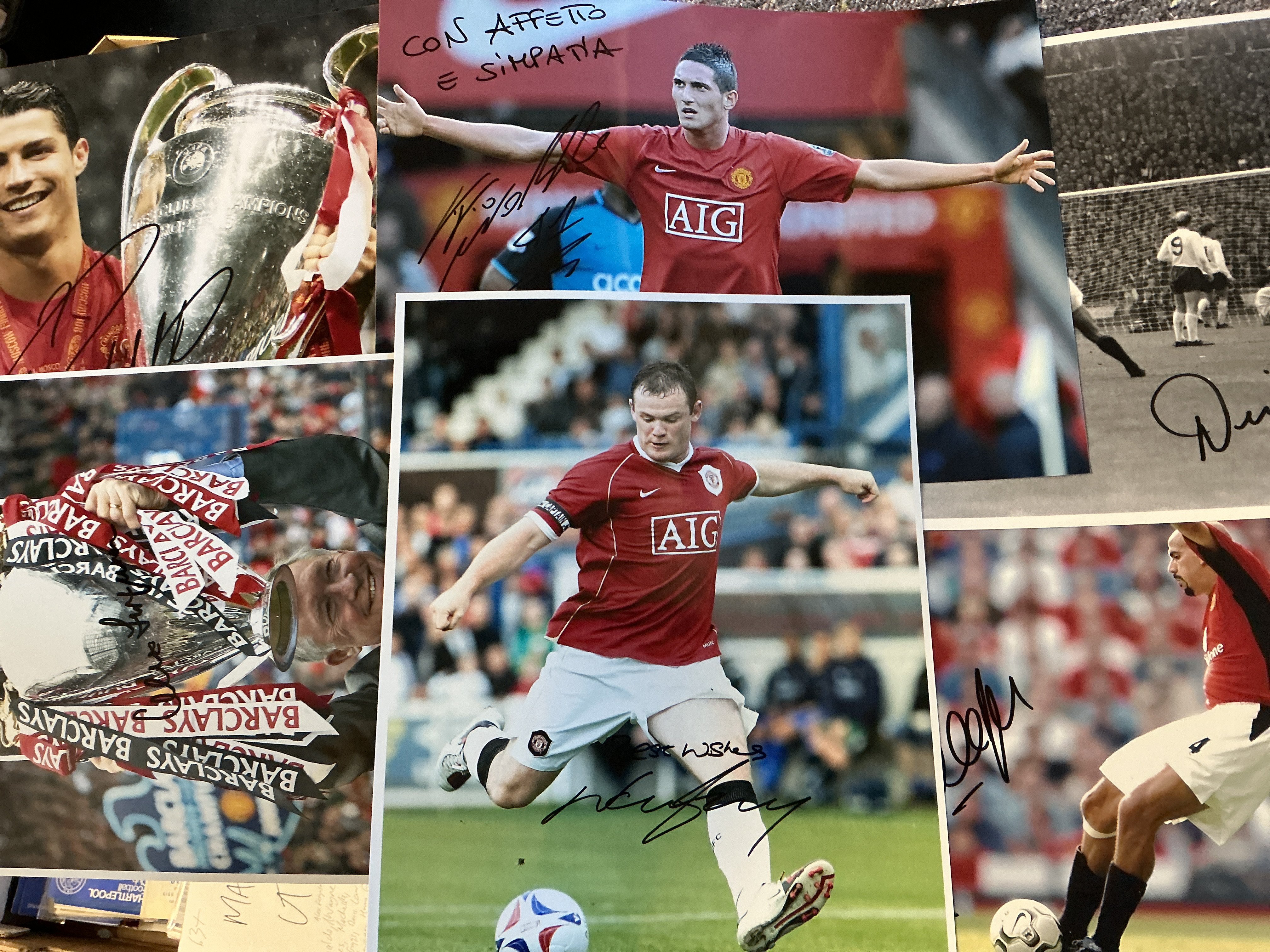 Manchester United Signed Football Photos: Large photos/prints to include many legends. Rooney Ronaldo Scholes Pearson Giggs Ferguson Law Sharpe Stepney Gregg and more. Nice lot. (63)
