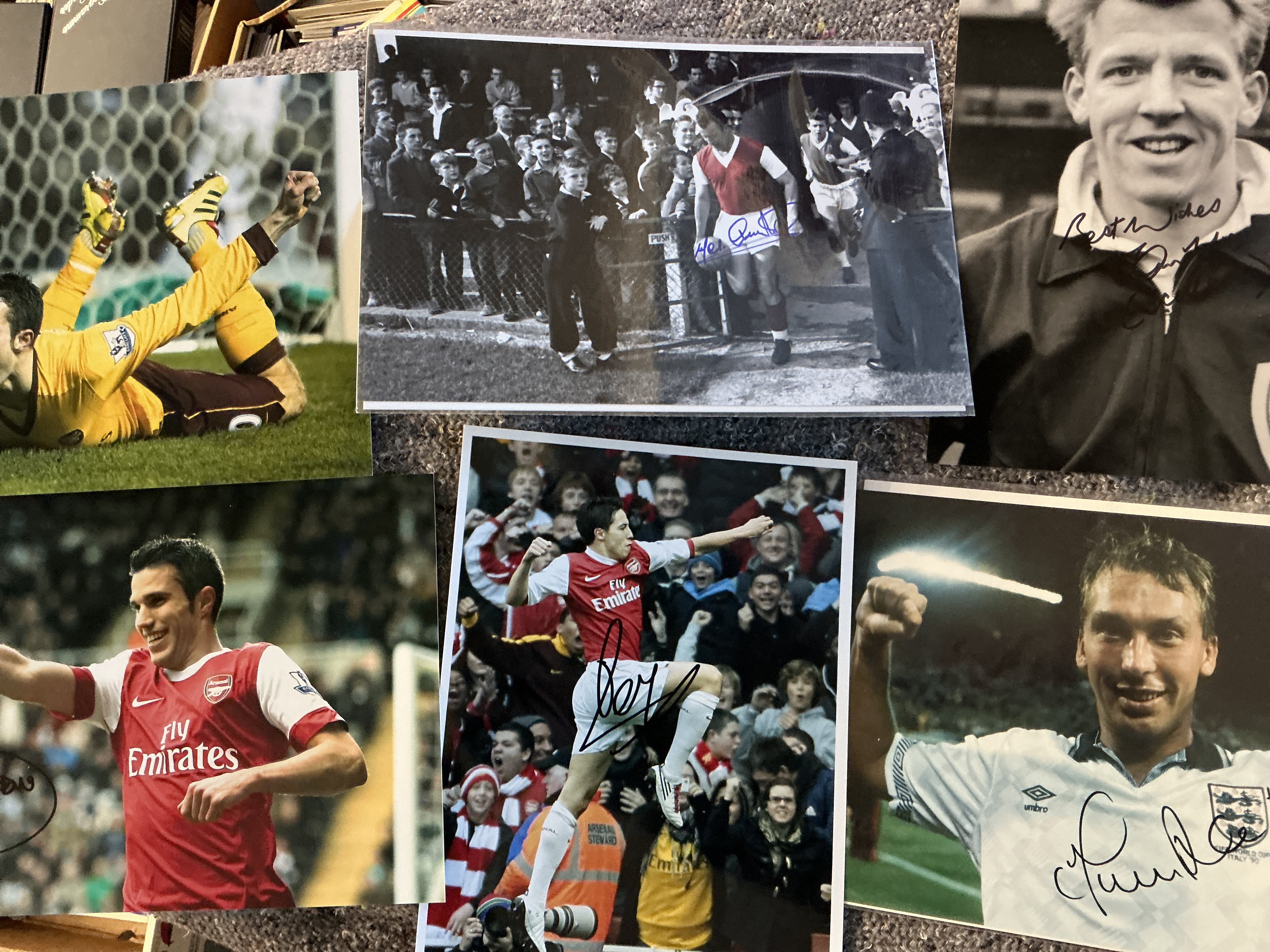 Arsenal Signed Football Photos: 18 large photos/prints to include Sunderland Wright Talbot Simpson Fabregas Van Persie Charles Ure and more. C/W a small autograph book from the 90s with around 100 signatures to include Thomas Parlour with some Sheffield Wednesday and Portsmouth etc also.