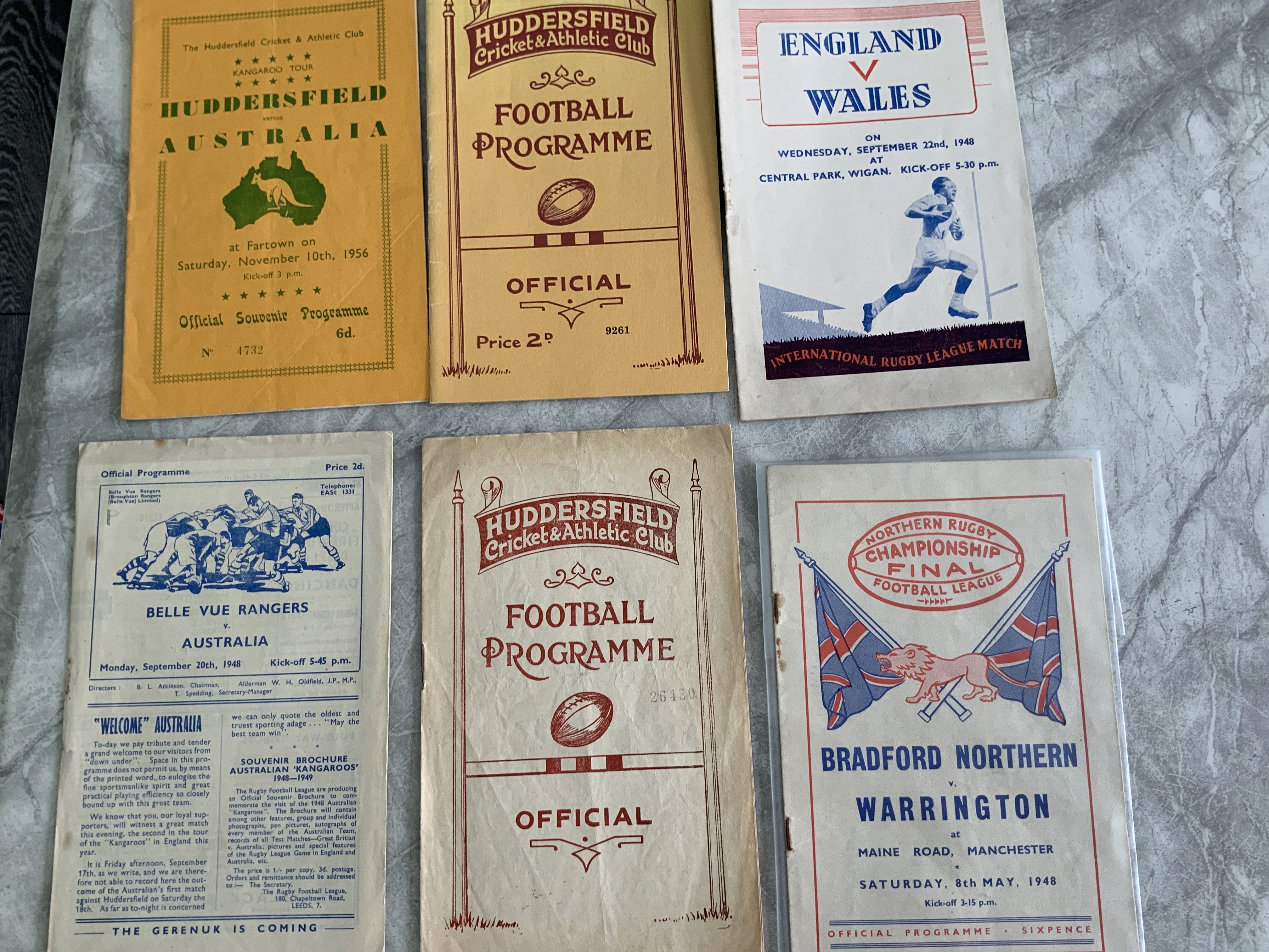 1940s Rugby League Programmes: Includes 32/33 Huddersfield v Dewsbury, 47/48 Huddersfield v Hull, Bradford Northern v Warrington, 48/49 Belle Vue v Australia, England v Wales at Wigan. There are numerous Wigan programmes from the 50s and 60s to include the 1952 Jubilee. C/W a Rugby League manual and more.