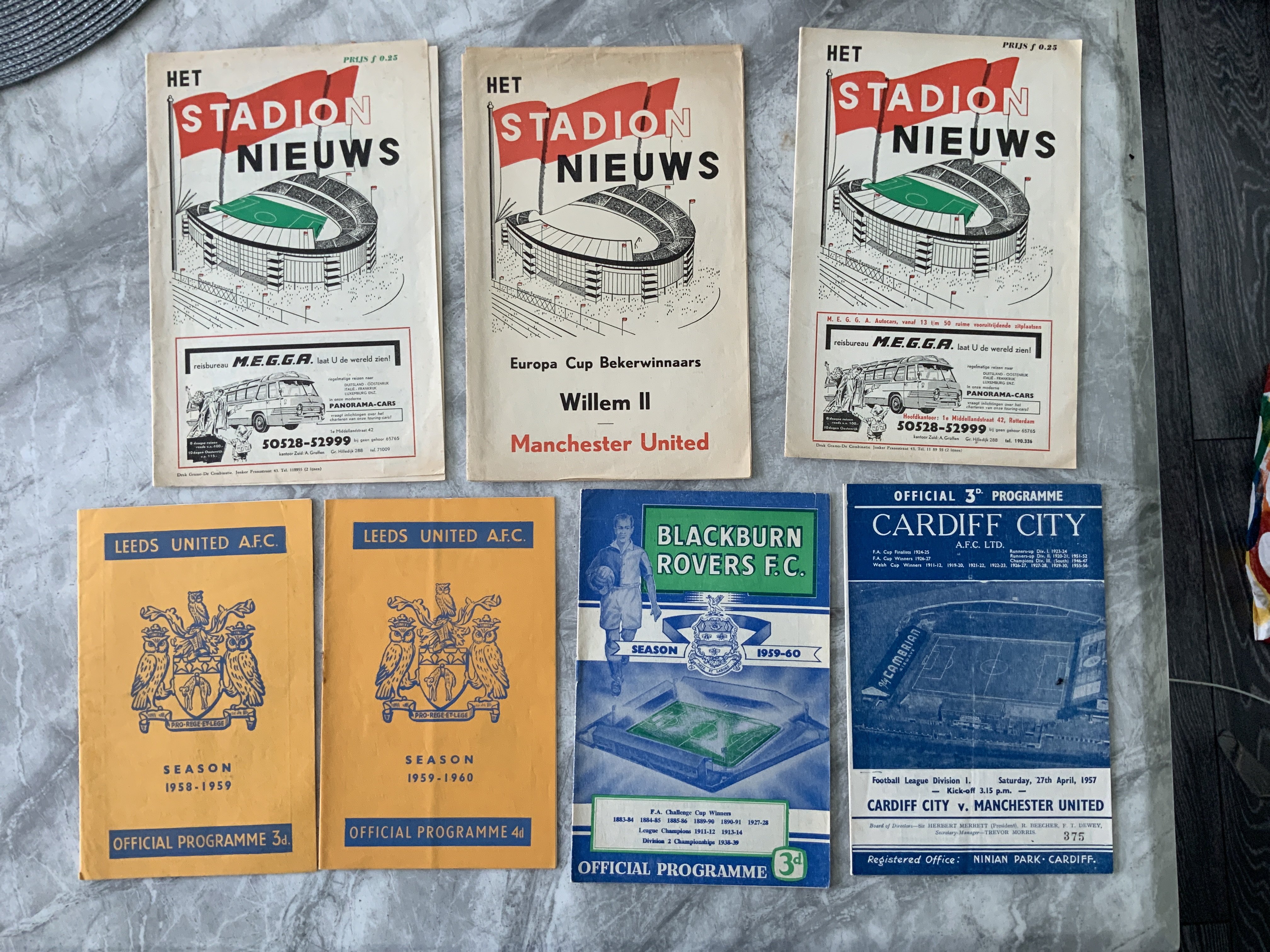 Manchester United Away Football Programmes: 56/57 Cardiff, 58/59 Leeds, Feyenoord, 59/60 Leeds, Blackburn and both versions of the 63/64 Willem. Very good. (7)