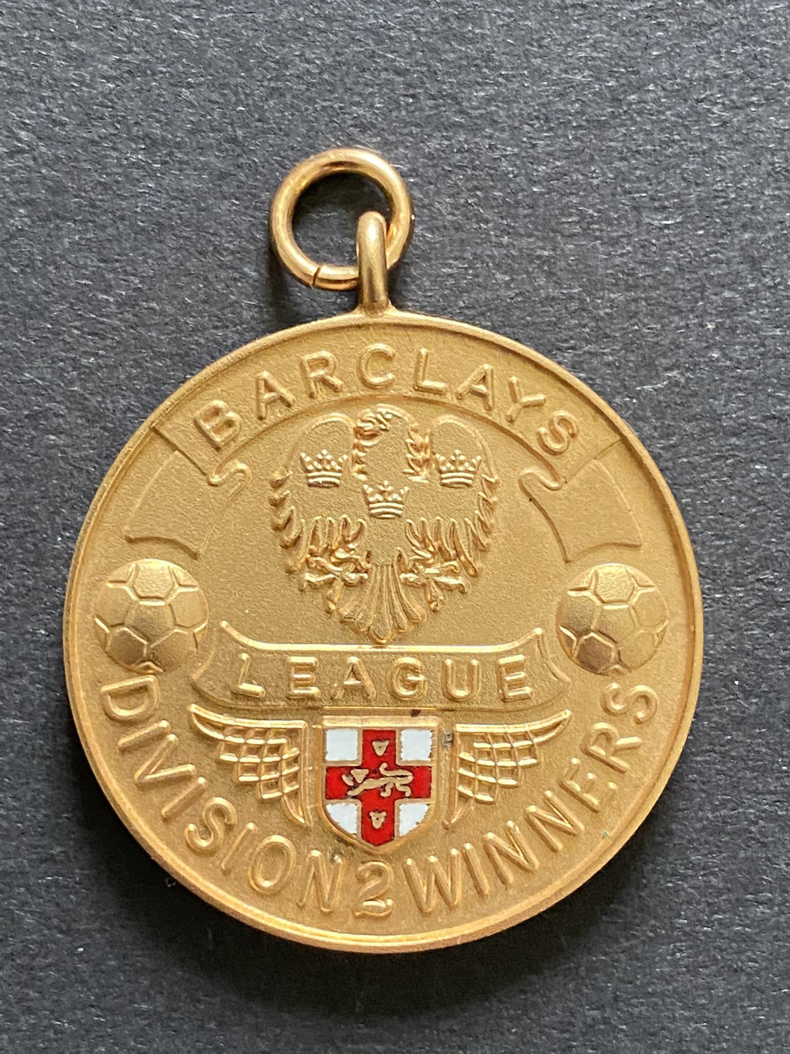 John Lyalls Ipswich Town 91/92 League Division Two Winners Medal: 9ct gold Vaughtons + Sons medal in original box awarded to manager John Lyall. Front reads Barclays League Division Two Winners the reverse stating Season 1991-92. Last ever season of the Football League after 93 seasons where these lovely gold medals were awarded. Ipswich were to start the season in the first season of the Premier League. This is the same medal as the players received. COA from family.