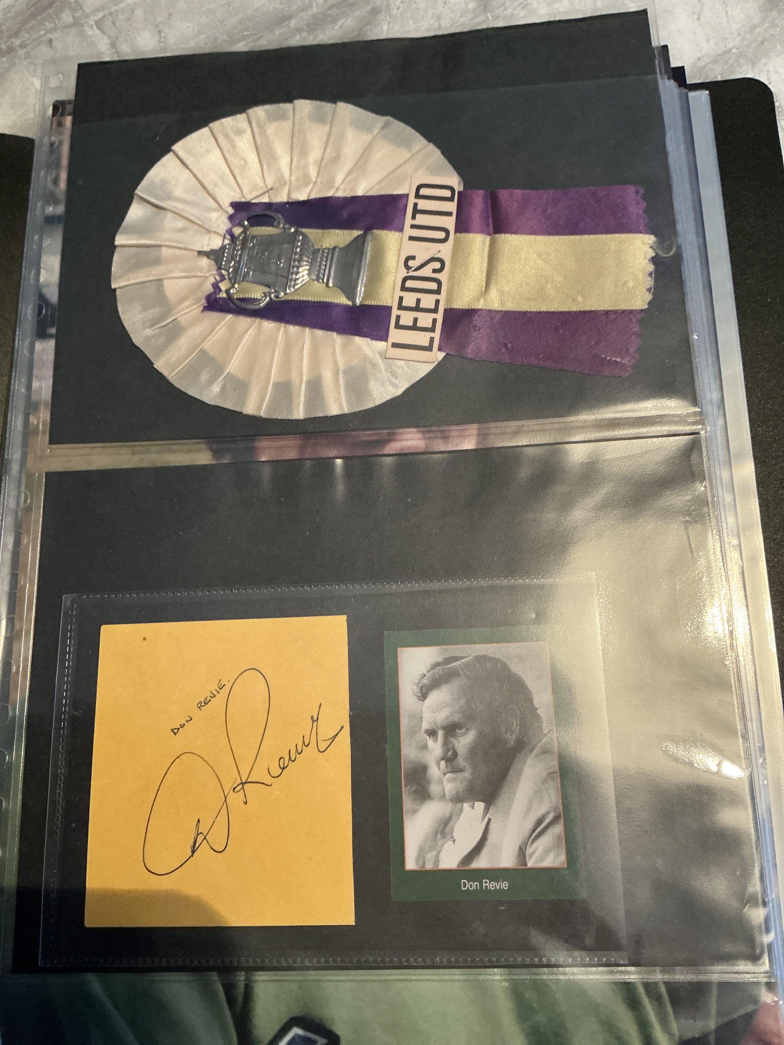 Leeds United Early 1970s Signed Football Photos: 12 x 8 inch photos hand signed by Sprake Harvey Bates Charlton Hunter Reaney Lorimer Giles Gray and Jones. Signed at organised event when the Revie statue got unveiled. C/W Bremner magazine picture and Revie yellow card and a Leeds FA Cup rosette. Neatly kept in collectors folder.