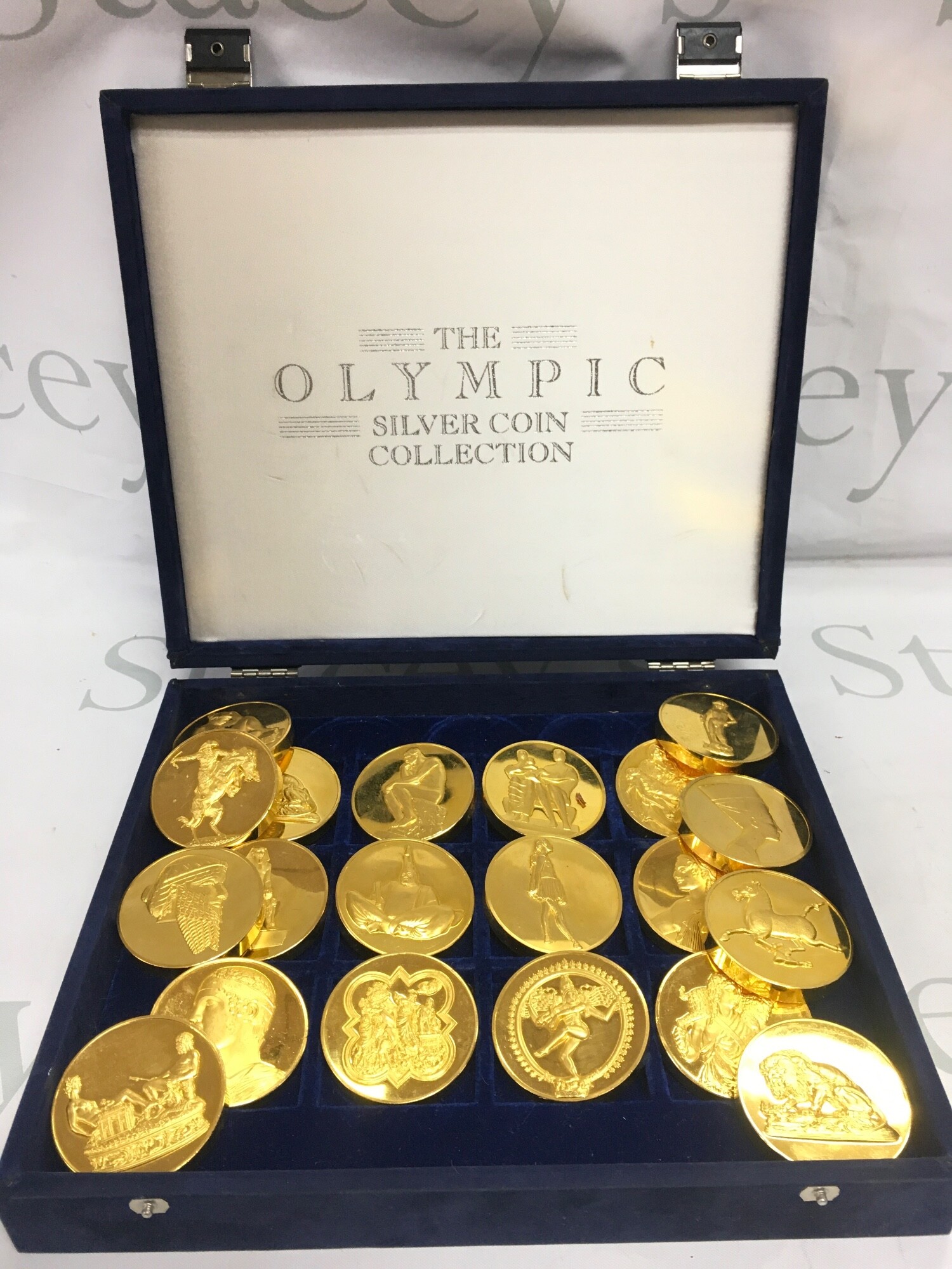 A set of 20 4oz gold plated bronze medallions