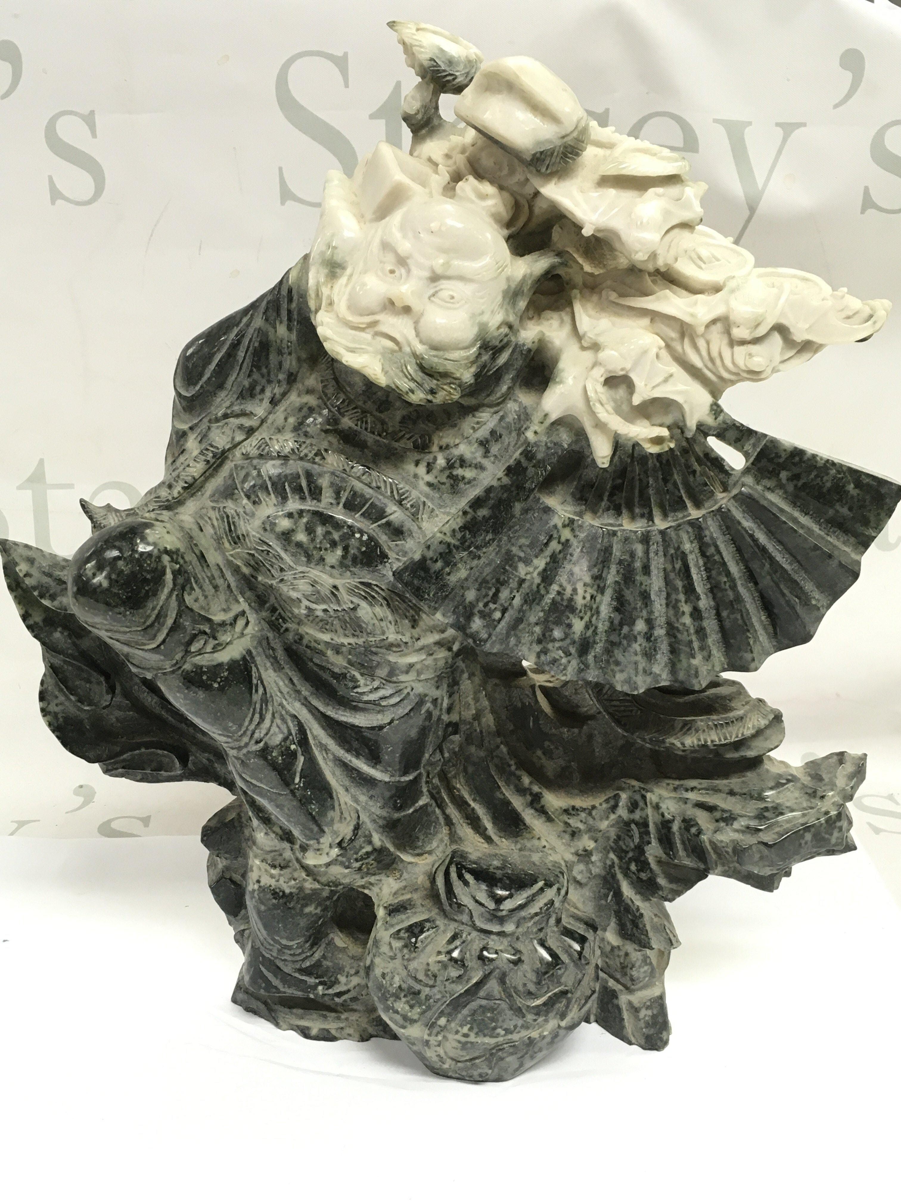 A Large Jade Guardian figure ,34 cm tall 28cm wide.