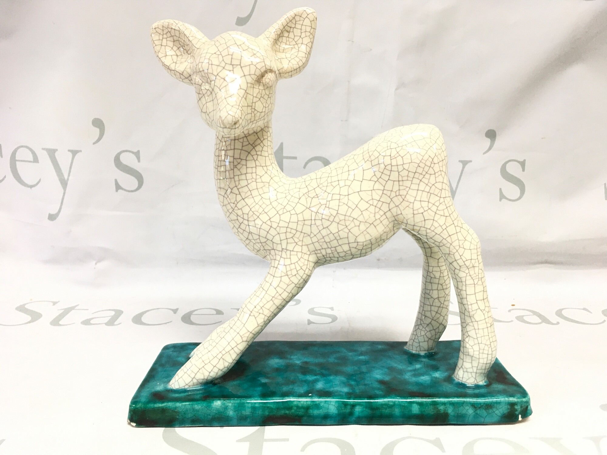 An Austrian Goldscheider Pottery lamb figure. 22cm tall.