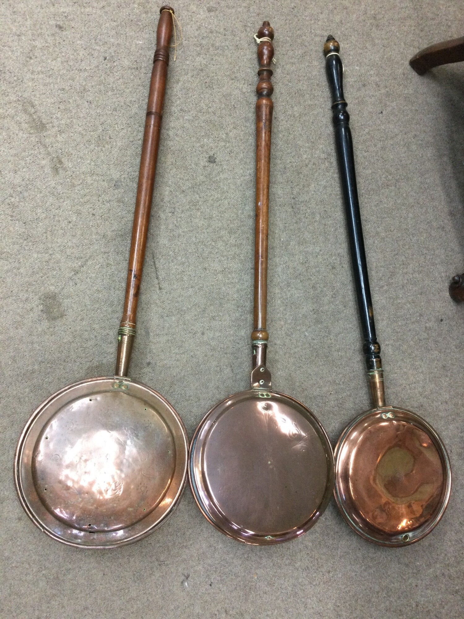 Three copper bed pans