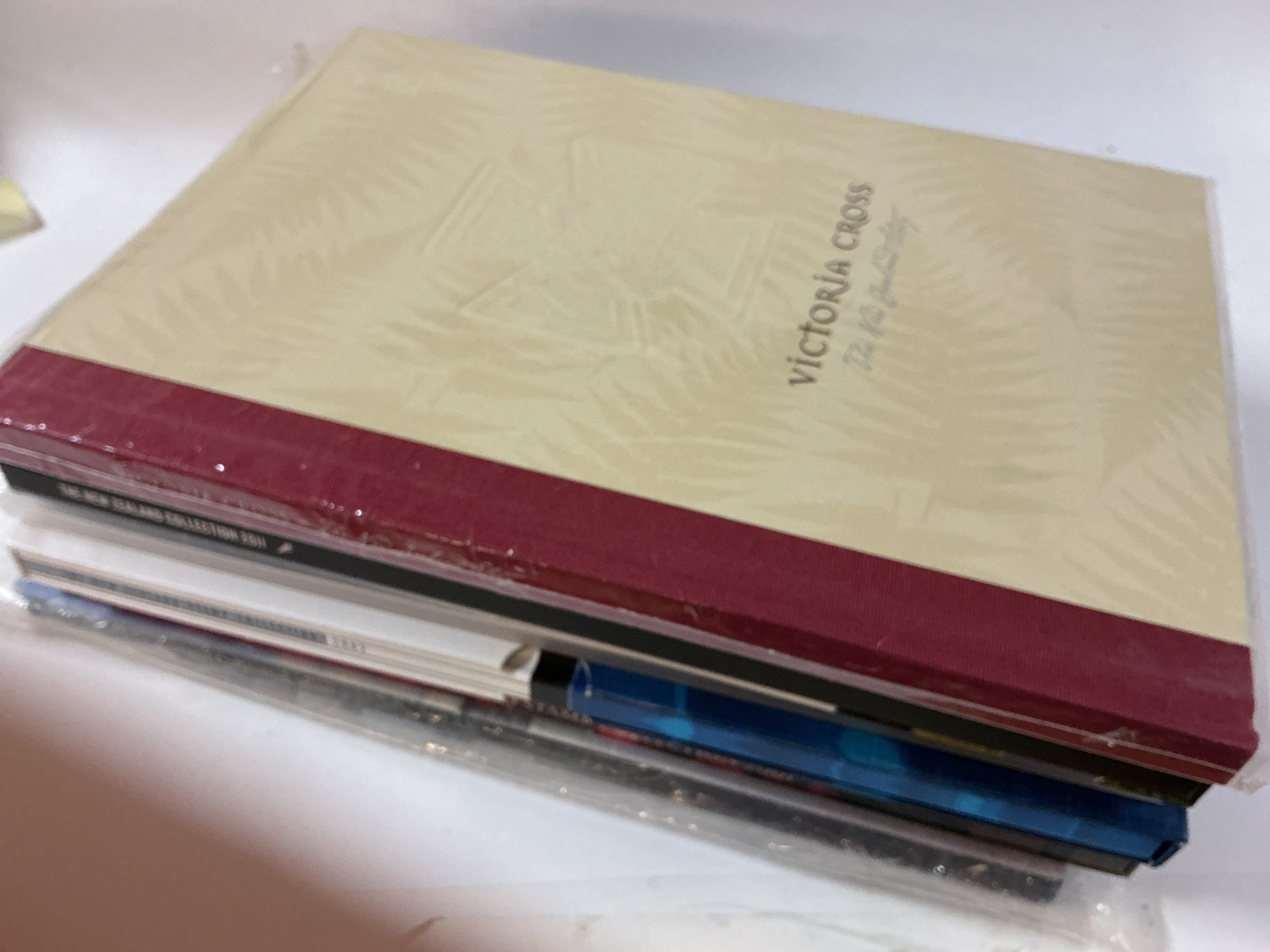 A collection of 7 Australia and 6 New Zealand postage stamps including year books mostly from the 2000 era.