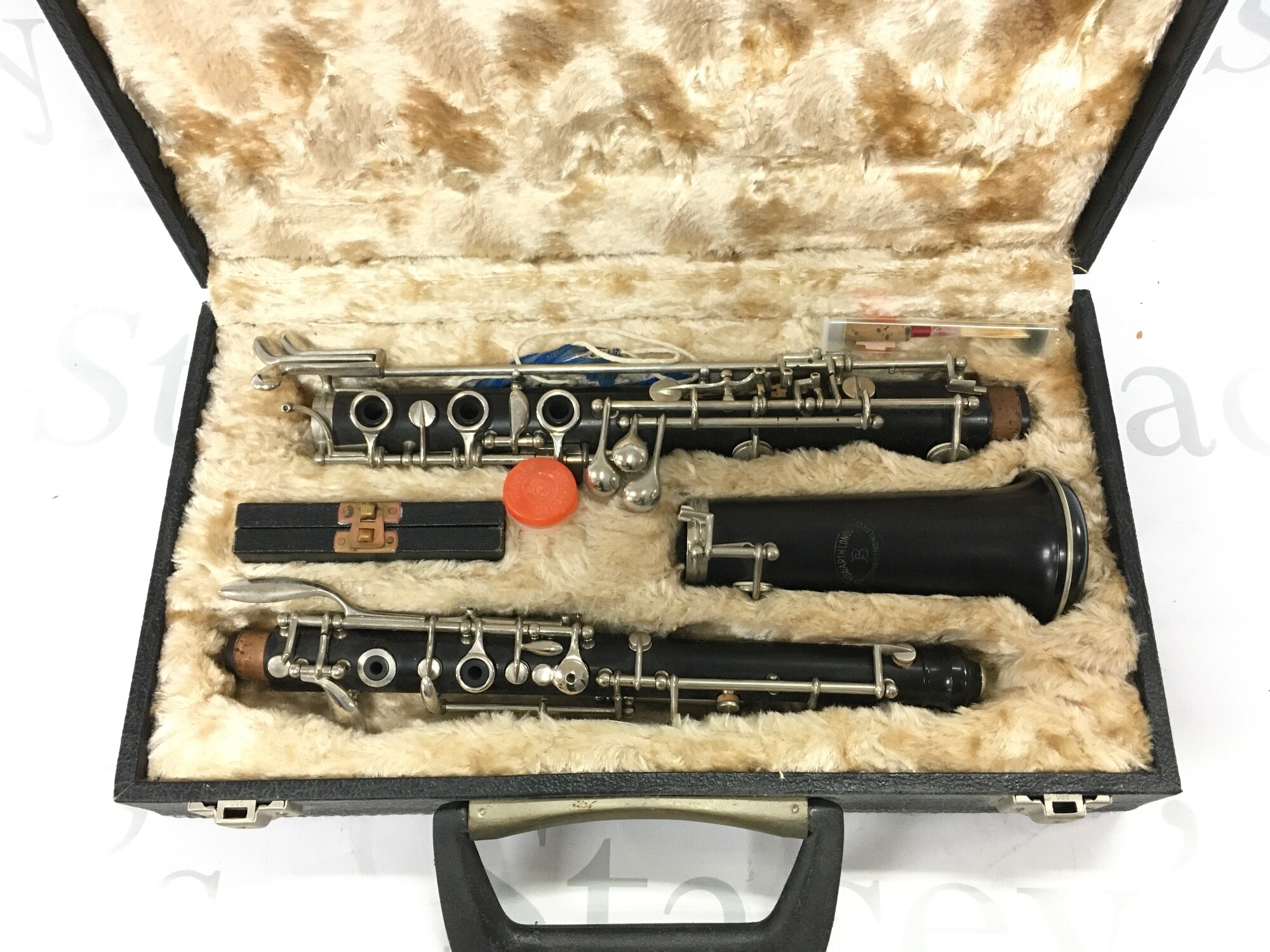 A Howard Romeo Orsi Milano oboe in a fitted case