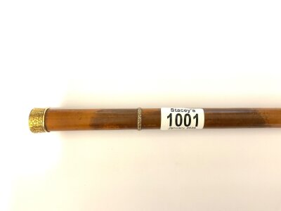 An antique high ct gold topped walking cane.