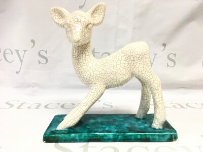 An Austrian Goldscheider Pottery lamb figure. 22cm tall.