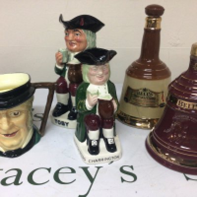 Two fubottles of Bells Whiskey Toby and Charrington caricature jugs and others.- NO RESERVE