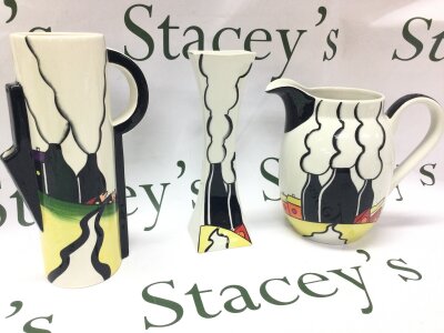 A Lorna Bailey jug and two vases, 18 to 24cm tall. There is some crazing and scratches seen