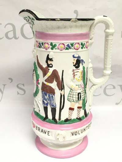 A Victorian Staffordshire pottery jug commemorating Great Britain's armed forces. Some damages. Approx height 2cm.