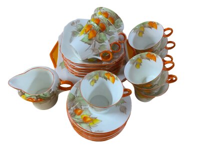 SHELLEY; a Thirty seven piece Art Deco part tea service with hoop handles and Autumn flowers and leaves, pattern no. 12299.